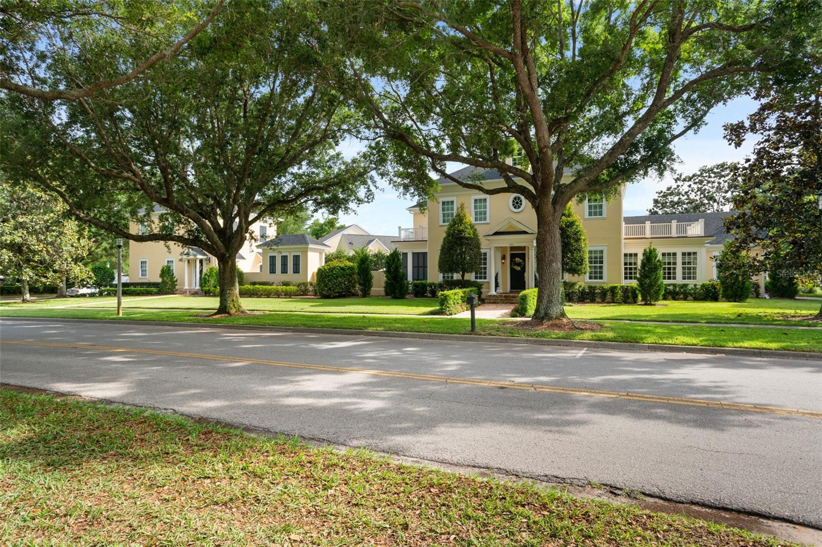 Welcome to this magnificent one-of-a-kind estate in the Main Village of Celebration, totaling 20,299 square feet, and takes full advantage of its ‘block to block’ location, 2 Lots in 1, across from the Celebration Golf Club. The main house was thoughtfully designed with high end materials and craftsmanship. It features a Poggenpohl stunning kitchen with Onix counter top, a private dinning room, a studio/office, a bonus room, an equipped gym and an oversized laundry room. Upstairs, you will find the Master Suite (second floor) offering two large walk in closets and a marble filled master bath featuring a soaking tub, large shower and dual sinks. The two other suites has also a lot to offer! Some of the upgrades includes high standard chandeliers (list attached); well designed wall papers; customized built in walk in closets; totally personalized linen and blackout curtains; a technologic and automated multi-room audio system; a movie room (3rd floor) planned by Crowne Audio, with special and comfortable tailored Canadian seats; and much more!! The screened patio has a gas fireplace and a luxurious built in grill and hood, with Amazonite counter top and back splash. The house has an extraordinary pool with spa surrounded by Shell Limestone Paver and a masonry walled in back yard. In addition, there is more than enough green space for outdoor activities. The second part of this beautiful home offers an over-sized three car garage, perfect for the car collector as it has plenty of height for car lifts. Above the garage, you will find a complete, independent and modern apartment, perfect for your guests! Enjoy the well desired Celebration Community, walking distance to downtown Celebration and across the street from the golf course! You can’t miss it!!