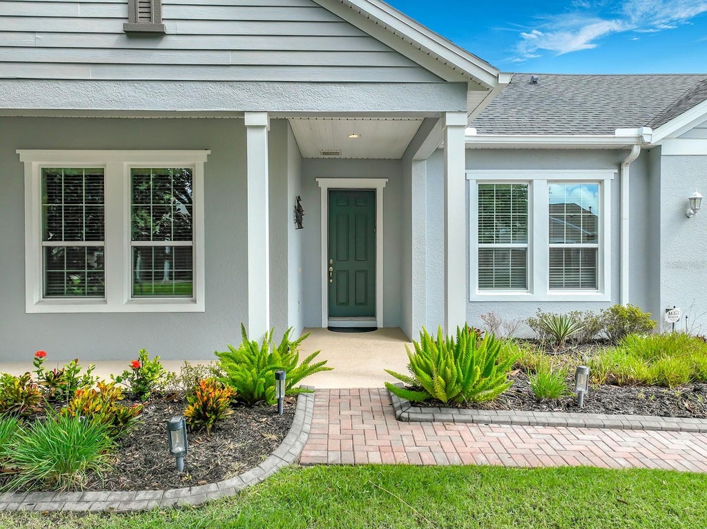 Photo of 107 Balmy Coast Road, Groveland, FL 34736 (MLS # O6430958)