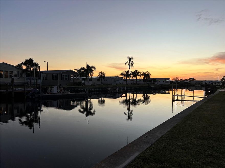 EXCELLENT PRICE on this large CANAL FRONT LOT IN HARBOR COVE! Presenting a WATERFRONT Gulf Access lot in a premier 55+ community nestled along the scenic Myakka River. Put a new manufactured home on this land and create the waterfront lifestyle you’ve been dreaming of. Experience serene water views and spectacular sunsets from this nice size lot which includes a Membership Share, is in the pet section and has underground utilities. Harbor Cove is a very desirable community due to its location, lush landscaping, plentiful amenities and affordability! HOA dues only $135 per month. Outdoor lovers have endless opportunities to enjoy this peaceful natural setting, abundant wildlife, excellent boating and incredible fishing.  The community features a 90 slip marina, 2 story clubhouse, 2 pools, spa, fitness center, pickleball, tennis, shuffleboard and bocce ball. There are dances, golf cart parades, block parties, card games and trivia plus numerous clubs for crafting, woodworking, etc. Shopping, dining, grocery stores and medical services are nearby in both North Port and Venice. Gorgeous gulf coast area beaches are a short drive away as well as spring training facilities, Warm Mineral Springs, farmers' markets and other attractions. Drive by today to envision your amazing future here!