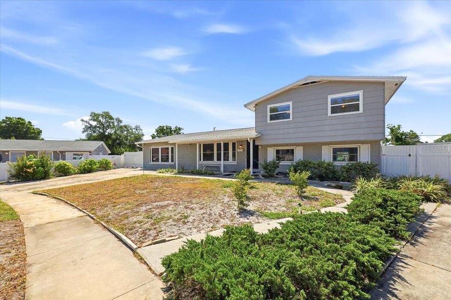 After 47 years, this 2,512 sq ft Town and Country POOL home on nearly 1/3 of an acre is available for its next owners! This split level home is perfect for entertaining, gardening + more. Bring your "toys"..with no HOA~ park your boat and RV. The oversized lot is waiting to be transformed into a backyard oasis. With 4 bedrooms, 2.5 bathrooms, and 2 large bonus living spaces, you'll find plenty of room to make this home your own. Tile, laminate, and wood floors throughout along with an updated kitchen with plenty of cabinet space. This tri-level home features the master bedroom down 3 steps on the lower level along with a full bathroom and additional small "5th" bedroom with closet that can be used as a nursery, office, or even transformed into a custom closet. On the main level you will find the kitchen with dining area, a formal living room up front, and 2 bonus living spaces that can be used as additional living rooms, bedroom, game room + more. The upper level features 3 generously sized bedrooms with 2.5 bathrooms. A new ROOF was installed in 2025 giving peace of mind. The outdoor covered PATIO overlooks the sparkling POOL and has room to entertain and host summer cookouts and parties!! Additional covered space can be used as a workshop along with the attached, open door 2 car garage! The backyard is perfect for growing your own fruits and vegetables and already has a producing avocado tree! A paved pathway through the backyard gives the ability to have your own secret garden. Minutes to TPA airport, you'll find yourself centrally located near shopping and major highways. Showing BY APPOINTMENT ONLY.