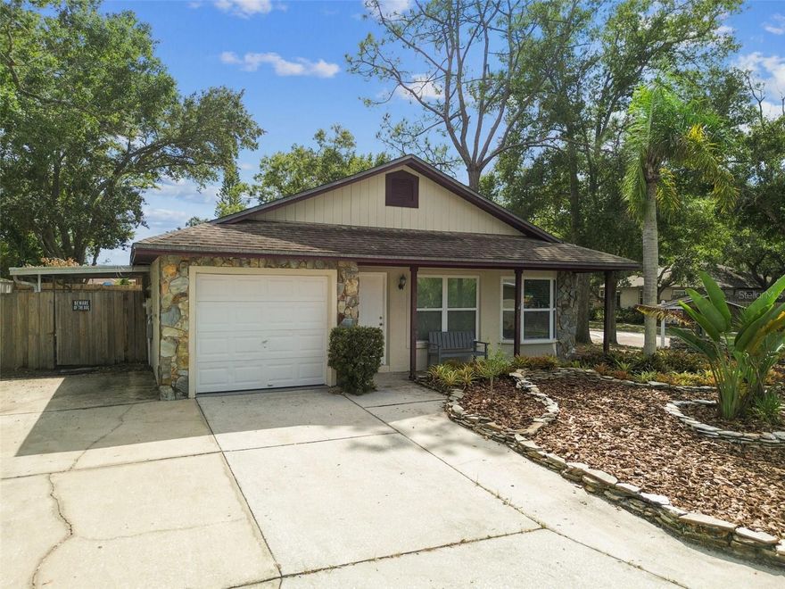 Welcome to the heart of Palm Harbor. Wonderful 2 bedroom, 2 bath home ideally located on a premium corner homesite and near to all! The house features an open concept living area centered by a custom stone accent wall and boasting soaring vaulted ceilings. The kitchen has notable updates including quartz countertops, brand new sink and faucet and stainless-steel appliances. New laminate flooring adorns the bedrooms and fresh paint in a fashionable; current color palette is found throughout the home. The primary bedroom is oversized with 3 closets! Storage galore! The second bedroom has an extra flex area that could be used as a workspace, gaming or hobby area... endless possibilities. Sizable backyard is fenced for ultimate privacy and a covered porch extends your entertaining and family living space. BONUS-HVAC is brand new! Located near to schools, shopping, restaurants and all that the charming Palm Harbor area has to offer as well as the nearby, famed Gulf beaches! Make it yours!