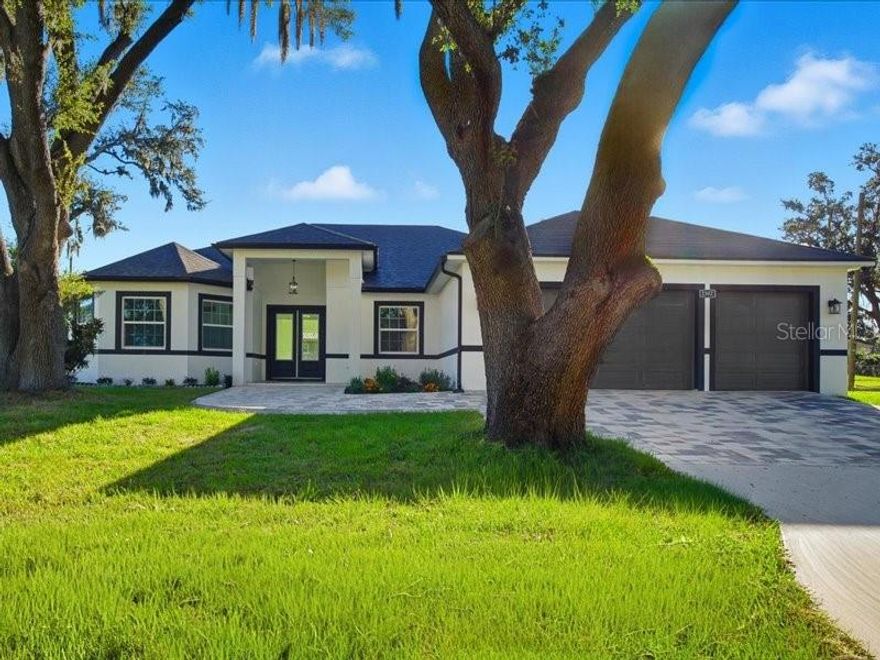 Welcome Home!
Discover this stunning property perfectly located between Tampa and Orlando, with convenient access to nearby restaurants, shopping, and a new hospital. Nestled in a quiet and peaceful neighborhood, this home offers the freedom of NO HOA and NO CDD.
This beautiful residence features a 3-car garage and a paver driveway and a private, blending elegance with practicality. Step through the impressive 8-foot double entry doors into a space filled with high ceilings and an open floor plan designed for modern living.
The oversized chef’s kitchen showcases wood cabinets, stone countertops, and brand-new stainless steel appliances — the perfect setting to gather with family and friends. From the kitchen, step out onto a spacious covered porch, ideal for entertaining or creating your dream outdoor kitchen.
The luxurious master suite feels like a private retreat, featuring two custom-built walk-in wood closets, extra storage, and a double-sink vanity.
Enjoy porcelain tile flooring throughout the entire home, including all bathrooms, where porcelain extends from floor to ceiling in each shower, adding a sleek and elegant touch.
Don’t miss out on this incredible opportunity to own a home that perfectly combines comfort, luxury, and location!