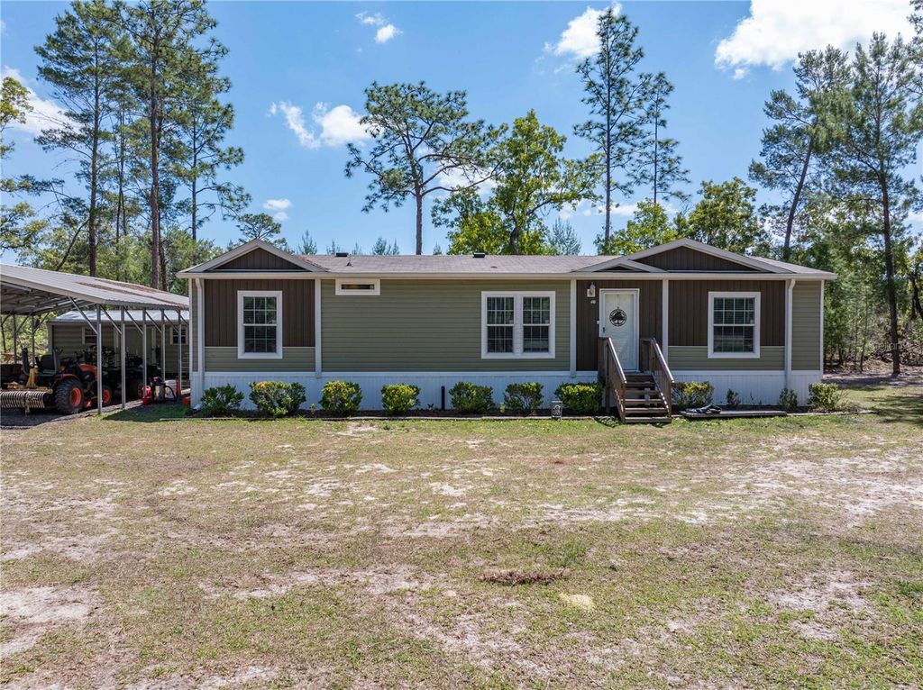 Photo of 221 Magnolia Road, Hawthorne, FL 32640 (MLS # GC539632)