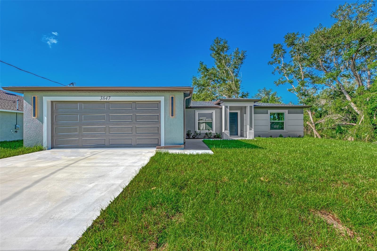 Under Construction. Brand new 3-bedroom, 2-bath home in North Port, FL. This stunning residence features an open floor plan, quartz countertops, soft close cabinets, waterproof vinyl flooring throughout, and stainless steel appliances. The master suite includes a walk-in closet and a luxurious en-suite bathroom with tiled shower walls. Enjoy peace of mind with impact windows and the convenience of a two-car garage. The outdoor space offers ample room for activities. Conveniently located near local amenities, parks, schools, and shopping. Be the first to live in this beautiful home – schedule your showing today!Pictures are from a similar model and finishes may vary. All measurements should be verified by Buyers agent.