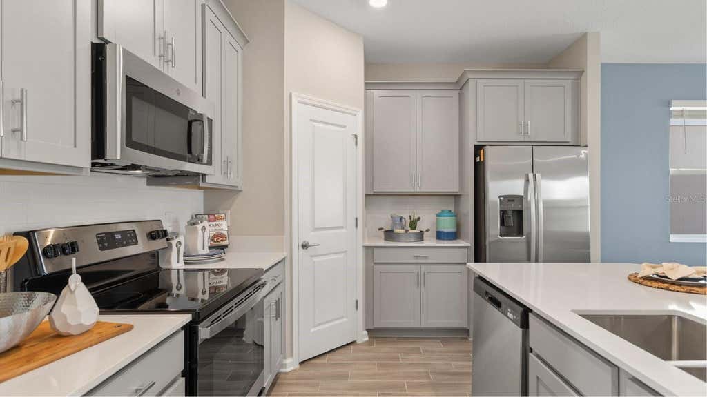 Photo of 5658 Kettlebell Alley, Clermont, FL 34714 (MLS # O6427083)