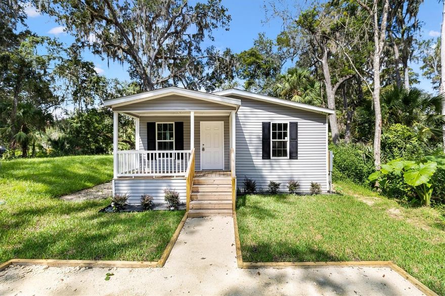 Welcome to your NEW charming 3-bedroom, 2-bathroom retreat! Nestled in the serene, rural setting of Lake Pan, renowned for its stunning 4,460 acres of spring-fed waters, abundant wildlife, scenic boat rides, and excellent fishing, this home is a haven for nature lovers. Just a short walk from a public boat ramp with easy access to Lake Panasoffkee, it offers the perfect location for outdoor enthusiasts. Newly constructed(2025), this 1,387+/- sq ft manufactured home boasts a durable construction featuring 25-year shingles, vinyl siding, a spacious front porch, an inside laundry room, and much more. The modern kitchen features sleek stainless steel appliances, shaker-style cabinetry, elegant countertops, and a spacious dining nook. The open living and dining area is ideal for entertaining guests or relaxing with family. The master bedroom is spacious with a walk-in closet and an ensuite featuring a walk-in shower with his/her sinks. The spare bedrooms are generously sized with the shared hall/guest bathroom offering a tub shower. The laundry room is spacious with plenty of room for storage. Whether you're a snowbird or a first-time homebuyer, this home truly has it all and is MOVE-IN READY. Don’t miss out—call today before it’s gone!