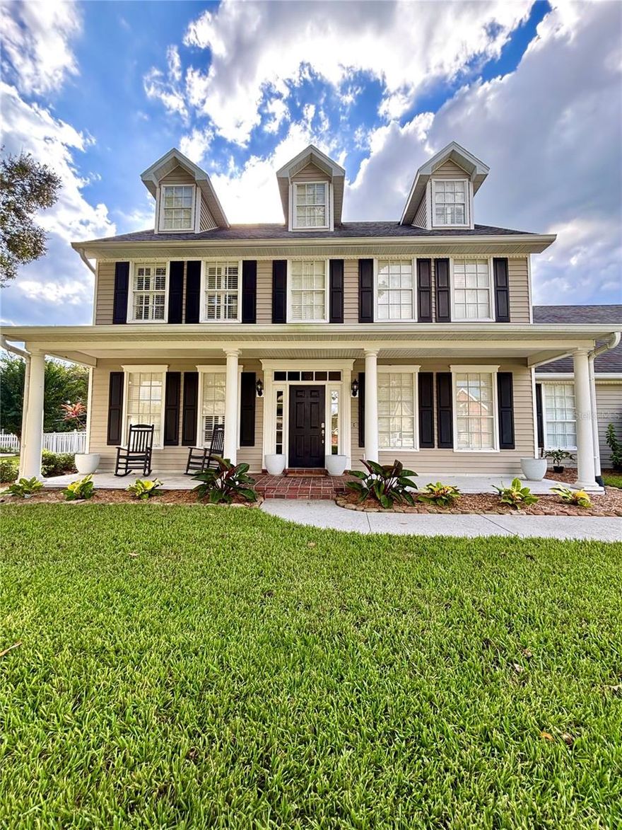 PROFESSIONAL PHOTOS COMING SOON. The wood floors are currently being sanded and re-stained, and the primary bathroom is undergoing a beautiful renovation — this home will look even more stunning once complete. 

Welcome to your storybook Southern home in the highly coveted, gated community of The Village at Scott Lake. This stunning 3-story, 6-bedroom, 3.5-bath pool home offers 3,364 sq. ft. of heated space (4,162 total) and sits on a beautifully landscaped .33-acre lot — perfect for entertaining and outdoor living.

From the moment you arrive, this classic Southern-style home captures attention with its large covered front porch, stately columns, high-pitched roof, and three gabled dormer windows that flood the home with natural light. The perfect symmetry, lush landscaping, and welcoming oversized front yard create incredible curb appeal. A side-entry 3-car garage with an extended driveway (complete with basketball hoop!) offers plenty of parking and play space.

Inside, the first floor features wood flooring throughout, a dedicated home office/ study, formal dining room, spacious living room with a cozy wood burning fireplace and a beautiful kitchen with granite countertops, island bar, and breakfast nook. Three French doors open out to the massive screened lanai with pool and spa — the perfect place for weekend barbecues, Sunday football, or quiet evenings. Beyond the screen enclosure, you’ll find a brick-paved area perfect for a firepit, tropical landscaping, and plenty of yard space to play. 

On the second floor, the primary suite boasts a completely renovated spa-like bath with stand-alone soaking tub, tiled shower, and walk-in closet. Four additional bedrooms and a convenient laundry room complete the second level. The third floor offers a spacious bonus room with balcony and another en suite bedroom, ideal for guests, teens, or a media/game room.

The Village at Scott Lake provides resort-style amenities including a clubhouse, tennis courts, and private boat ramp to Scott Lake. Club house is free for all residents to reserve for events.  This prime location is central to everything — dining, shopping, schools, and major highways — while still offering the privacy and security of a gated community.

This home is a rare find, combining classic Southern architecture, modern updates, and a spacious floor plan — truly a one-of-a-kind opportunity in one of Lakeland’s most coveted neighborhoods.