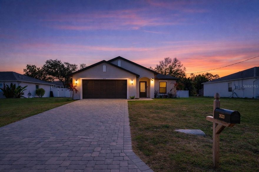 Newer 2023 construction with an open floor plan, high ceilings, oversized kitchen island with seating for eight, fenced backyard, and no HOA. Located in northeast North Port near the Port Charlotte line, this move-in ready home offers convenient access to shopping, dining, and everyday services while still enjoying the quiet residential neighborhoods that have made North Port one of Southwest Florida’s fastest growing communities. This well designed 3 bedroom, 2 bath home offers 1,694 square feet with a split bedroom layout that provides privacy for owners and guests. The bright great room flows into a spacious kitchen designed for gathering and everyday living with stone countertops, solid wood cabinetry, a large walk-in pantry, oversized island with breakfast bar seating, and additional dining space in the kitchen. Neutral luxury vinyl plank flooring runs throughout the main living areas creating a clean modern look that complements any décor. The primary suite includes a walk-in closet and a private bath with dual sinks. Built with solid block construction in 2023, the home provides peace of mind with newer major systems including the roof. The fully fenced backyard with white vinyl privacy fencing and patio creates a great outdoor space for grilling, relaxing evenings, or gathering around a firepit. Conveniently located with quick access to I-75, public boat ramps, parks, golf, and Gulf beaches in Venice and Englewood, while also being minutes from shopping and restaurants in Port Charlotte and spring training games at CoolToday Park. Move-in ready newer home offering modern finishes, outdoor space, and convenient Southwest Florida living.