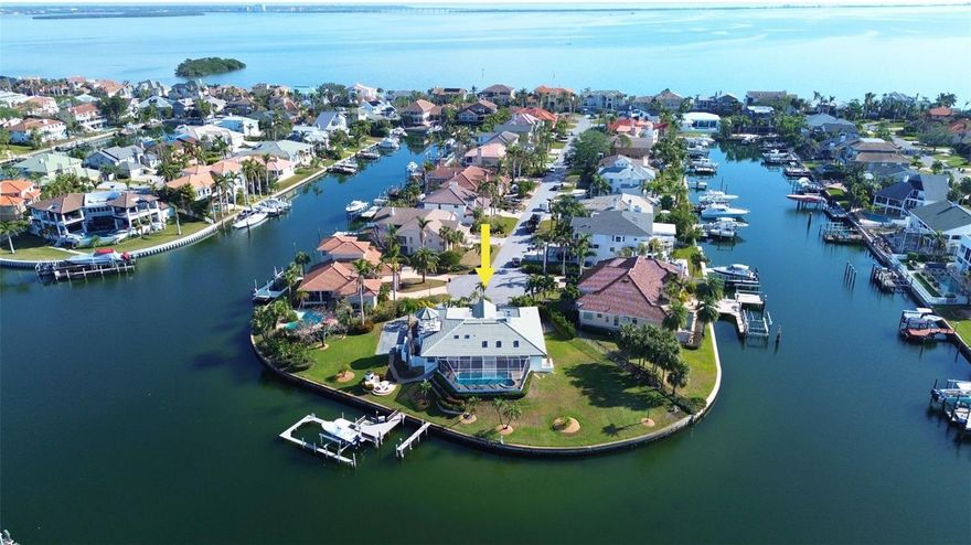 Discover an exquisite waterfront oasis with 280 FEET OF STUNNING WATERFRONT, on deep protected water offering a tranquil retreat in this custom-built, elevated residence. This 4-bedroom, 3-bathroom home effortlessly combines single-level living with the security of being high and dry, remaining unscathed by storms Milton and Helene. Upon entering, you'll be greeted by elegant travertine floors, soaring vaulted ceilings, and an open-concept design that radiates sophistication. Designed to seamlessly blend indoor and outdoor living, the home features an elevated screened-in lanai and pool. Nearly every room offers breathtaking views of the pristine waterfront and expansive backyard, creating a serene ambiance throughout. Built with quality block materials and equipped with roll-down storm shutters, this residence ensures peace of mind. At the heart of the home is a tastefully renovated kitchen, boasting custom cabinetry, gleaming granite countertops, vaulted ceilings, and a convenient breakfast bar overlooking the great room and pool area. The primary suite is a luxurious retreat, complete with a spacious walk-in closet featuring a custom organization system and a recently renovated en-suite bath. For mariners, a large dock awaits, accommodating multiple vessels on deep, protected waters with unobstructed access to the Gulf of Mexico. This home perfectly blends elegance, comfort, and maritime charm. Enjoy easy interstate access, proximity to Florida's renowned beaches, and a short 15-minute drive to Downtown St. Petersburg. Tierra Verde is a haven for outdoor enthusiasts, offering miles of biking and walking trails on the Pinellas Trail, a community playground, baseball field, and tennis courts. Don’t miss this opportunity—call to schedule your private tour today!