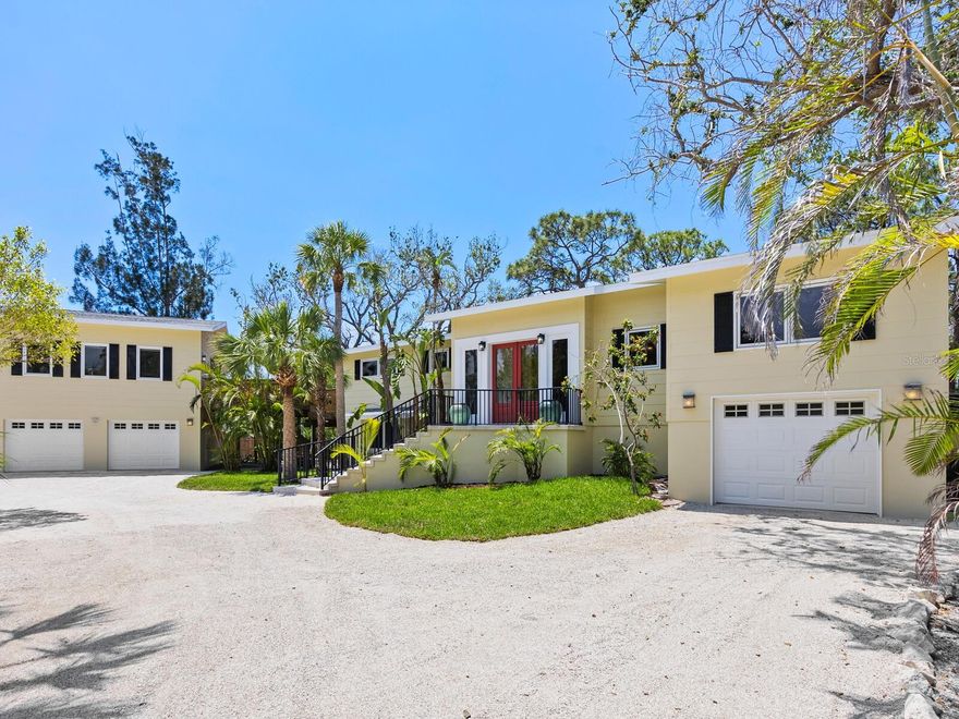 Welcome to the Sanderling Club, one of Siesta Key’s exclusive and sought-after neighborhoods, offering luxury living in the heart of paradise. As the island’s only gated single-family home community with 24-hour staffed security, Sanderling Club is renowned for its breathtaking beachfront properties, lush landscapes and outstanding amenities. This unique property offers two separate residences, with new roofs and exterior paint, and includes a combined four bedrooms, four bathrooms and 3,766 square feet of refined living space, including additional non-conforming living areas. Among grand live oaks and overlooking the waters of the Heron Lagoon with a combined nearly 50 acres of tranquil waters — a kayak enthusiast’s dream — the home is designed to embrace natural beauty that surrounds it. The main residence was originally built in 1960 and completely remodeled in 2010, featuring beautiful, polished travertine floors, soaring vaulted ceilings with skylights that illuminate the main living areas, and custom built-ins throughout. A modern chef’s kitchen showcases rich-toned cabinetry, stone countertops, a five-burner gas cooktop, built-in stainless steel ovens and refrigerator, a spacious pantry, and a large laundry room with built-in desk and ample storage. This home also features an open-concept den with built-ins. The dining room, wrapped in a wall of impact glass windows with lanai access, creates an ideal space for casual living and elegant entertaining. The private owner’s/primary suite occupies the entire upper level, offering an en-suite bath, private viewing deck, custom built-in bamboo cabinetry and convenient access to the guest house/in-law suite. The ground level includes a bedroom, bath, flex room with kitchenette, and an air-conditioned one-car garage with new epoxy-coated floors and 13-by-21-foot loft storage space. The guest house, with elevator access, was built in 2008 and features a combined living room and kitchen space, two bedrooms, a full bath, laundry facilities, two-car garage with additional storage and expansive decks overlooking the tropical landscaped backyard and Heron Lagoon waters — the ideal retreat for guests or extended family. The expansive backyard offers space to create your tropical oasis, with room for a pool and spa. Sanderling Club’s premier amenities include new Har-Tru tennis courts, pickleball, playground and a newly remodeled clubhouse (coming soon). Boat slips, when available, offer direct access to Sarasota Bay, the Intracoastal Waterway and the Gulf. All of this is just minutes from Siesta Key’s world-famous crystal quartz sand beaches and the charming shops and restaurants of Siesta Village. Plus, downtown Sarasota’s vibrant arts and culture scene — with its theaters, ballet, opera, museums, galleries and shopping — is just a short drive away. Don’t miss this rare opportunity to experience the best of coastal luxury living on Siesta Key.