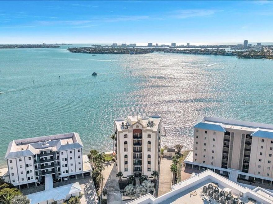 Looking for STUNNING water views? This property is a must-see! Welcome to Unit 6 at 378 Golden Gate Point—aN EXCEPTIONAL full-floor PENTHOUSE just one level below the top in one of Sarasota’s most coveted BOUTIQUE waterfront buildings. This SPACIOUS 3-bedroom, 3-bath residence offers panoramic views of Sarasota Bay and the city skyline from every angle. Enjoy over 3,000 square feet of light-filled living space with LUXURY VINYL PLANK flooring throughout, power blinds, and a PRIVATE ELEVATOR entry that opens directly into your unit. With windows spanning both the front and back of the building, you’ll experience BREATHTAKING sunrise and sunset views daily. Step outside to take in the coastal breeze from the expansive main balcony overlooking the water, plus enjoy four additional private balconies off select rooms—perfect for quiet morning coffee or watching the sun dip below the horizon. This residence includes a 2.5 PRIVATE CAR GARAGE, generous STORAGE, and a SPACIOUS open layout ideal for entertaining. Located just minutes from downtown Sarasota, St. Armands Circle, and the beaches of Lido Key, this is WATERFRONT LIVING at its finest. Don’t miss the opportunity to own one of only seven exclusive residences in this highly sought-after building.