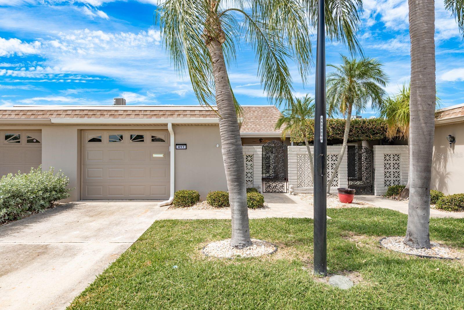 We invite you to take advantage of this exceptional opportunity to own a meticulously restored villa situated within the highly esteemed 55+ community of Boca Ciega Point. This distinguished residence comprises two bedrooms, two bathrooms, and an expansive garage. Notable features include an enclosed lanai and a generous gated front porch, ideal for relaxation and entertaining. Recent upgrades encompass a new patio/deck (2023), roof (2022), and updated heating and cooling systems (2019). The interior has been enhanced with refined lighting fixtures, luxurious quartz countertops, fresh interior paint, upgraded cabinetry in the kitchen and bathrooms, and elegant tile finishes throughout. Boca Ciega Point stands as one of Pinellas County’s premier boating communities, offering an exceptional Florida lifestyle. The community’s amenities include a large heated swimming pool, hot tub, tennis and pickle ball courts, two clubhouses, a fitness facility, shuffleboard, bocce court, extensive library, putting green, and numerous recreational facilities. Additionally, residents may enjoy the community pier for fishing, observing spectacular sunsets, and dolphin viewing.Conveniently located just minutes from parks, scenic beaches, fine dining establishments, shopping centers, cultural institutions, and the VA Medical Center, this property offers unparalleled accessibility and leisure opportunities. We welcome you to contact us today to arrange a private viewing of this remarkable property.