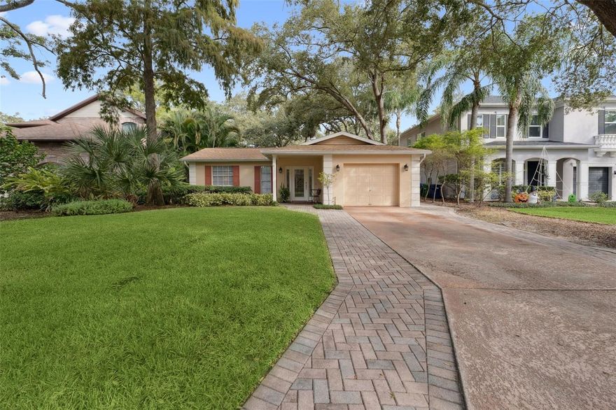 Discover this charming and beautifully updated three-bedroom, two-bath ranch-style home located in one of South Tampa’s most desirable neighborhoods. Classic, but thoughtfully modernized, this home perfectly blends classic character with contemporary comfort, all just minutes from downtown Tampa, Bayshore, Hyde Park, and top-rated schools.

Step through the lovely leaded-glass front door into a bright and welcoming living room and a separate family room at the back of the home, complete with a cozy fireplace. Beyond that, a spacious sunroom offers even more living space, ideal for a home office, playroom, or relaxing retreat.

The updated kitchen is a true highlight, featuring white cabinetry, stainless steel appliances, granite countertops, and a large island overlooking an inviting eat-in dining area with custom built-ins. The split floor plan provides excellent privacy, with a sunny master suite overlooking the beautifully landscaped backyard. 

This meticulously maintained home also features a one-year-old roof and is located outside of a flood zone within a highly rated school district. With its thoughtful updates, excellent layout, and unbeatable South Tampa location, this home is move-in ready and truly a rare find that won’t last long.