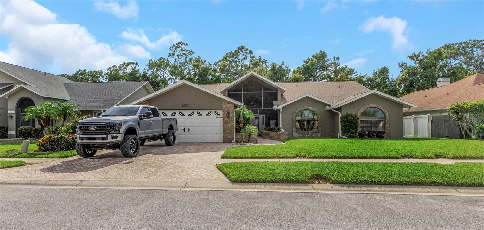 Welcome to 6007 Fall River Dr, a meticulously maintained 4-bedroom, 2.5-bathroom home nestled in the heart of New Port Richey’s desirable community of River Crossing. Situated on a serene conservation lot, this move-in ready property offers the perfect blend of comfort, privacy, and modern upgrades. Step inside to find a spacious and inviting layout ideal for both everyday living and entertaining. The bright, open floor plan features separate living and family rooms, a well-appointed kitchen with ample cabinet space, and a dedicated dining area overlooking the pool and wooded backdrop. Enjoy peace of mind with recent upgrades, including a new roof, new pool equipment, and new pool cage screening, ensuring years of worry-free outdoor enjoyment. The sparkling screened-in pool and lanai provide the ultimate Florida lifestyle—perfect for relaxing or hosting guests year-round. All four bedrooms are generously sized, with the primary suite offering a walk-in closet and an en-suite bath with dual sinks, a soaking tub, and a separate shower. Located in a quiet, well-kept neighborhood with no rear neighbors, this home is just minutes from shopping, restaurants, schools, parks, and medical facilities. Don’t miss your chance to own this updated, private oasis in one of New Port Richey’s most sought-after areas. Schedule your private tour today!