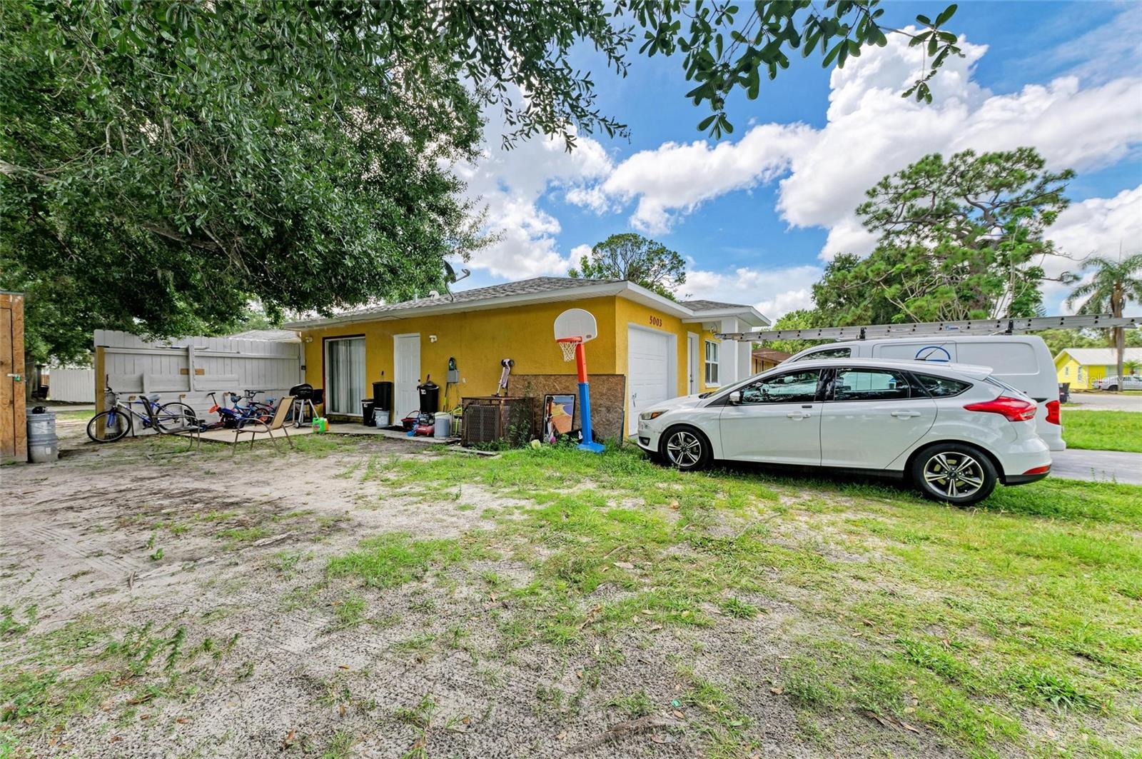 This versatile duplex offers an ideal opportunity for investors or owner-occupants looking to generate steady rental income. Positioned on a corner lot with an L-shaped structure, each unit features 3 bedrooms, 2 bathrooms, an attached 1-car garage, and the privacy of its own fenced yard.
One unit offers tile flooring, vaulted ceilings, a combined living and dining area, a galley kitchen with generous cabinet and counter space, a laundry room, and a sliding glass door access to a private fenced rear patio. The converted garage provides flexibility as an additional bedroom, office, or bonus room.
The other unit boasts an open-concept layout combining the living room and kitchen, sliding glass door access to the private fenced yard from the primary bedroom, and a large interior laundry room.
Conveniently located with easy access to US-301, SR-70, and I-75, this property is minutes from shopping, restaurants, a movie theater, banking, medical facilities, and a short distance to both Bradenton and Sarasota.
Whether you choose to rent both sides or occupy one, don’t miss this excellent investment opportunity perfectly positioned for long-term returns!