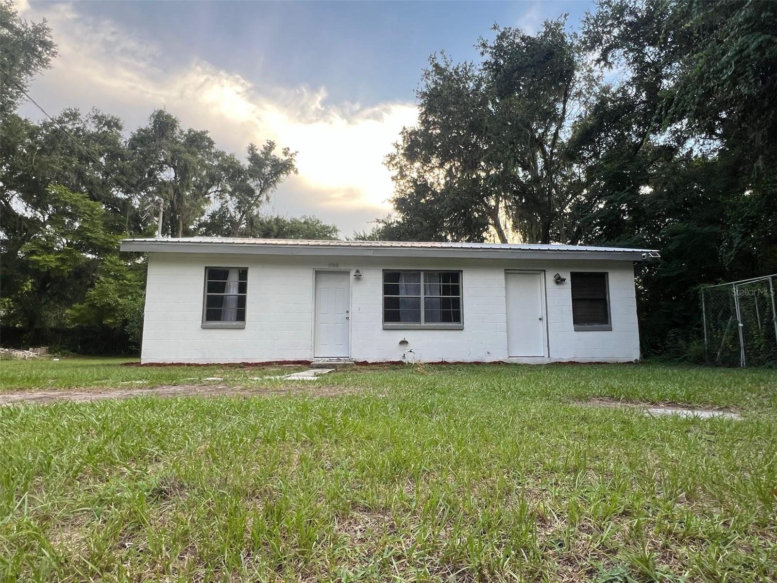 Renovated 2 Bedroom / 1 Bathroom Home on Nearly Half an Acre – Move-In Ready
This beautifully updated 2-bedroom, 1-bathroom home sits on a private 0.48-acre lot with vacant parcels on both sides for added peace and privacy. Set back from the road and surrounded by mature landscaping, the fully fenced yard offers space, security, and easy access. A Ring security system is included.
Recent upgrades feature wide-plank laminate flooring, fresh interior paint, an updated kitchen with modern cabinetry and durable countertops, plus a brand-new HVAC system with smart thermostat. Pest control and termite bond transfer to the new owner at no cost.
The open living/dining area flows into a functional kitchen, indoor laundry with washer/dryer, and a primary bedroom with private entrance and built-in shelving—ideal for guests, a home office, or creative studio.
Outside, enjoy two storage sheds, a carport/lean-to, a rolling gate, and a fire pit area for entertaining. There’s plenty of room for a pool, garden, or RV/boat parking.
**Bonus: Assumable VA mortgage available for qualified buyers. Conveniently located near Hwy 17, Hwy 60, Lakeland, Bartow, Winter Haven, and Fort Meade.
Don’t miss this rare opportunity—updated homes with land and privacy like this don’t last long in Bartow!
-