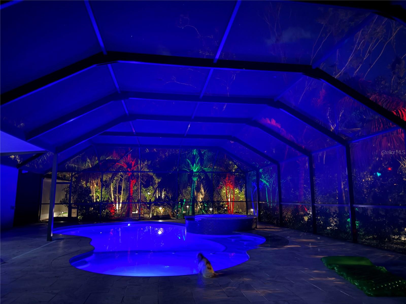 Welcome to 4735 Riverwood Circle, an extraordinary Sarasota retreat where luxury, comfort, and privacy come together in perfect harmony. Tucked away on a serene private corner lot, this home captures the essence of Siesta Key-style living, without Siesta Key prices. Every inch of this property has been meticulously upgraded with high-end finishes, professional landscaping, and premium systems, resulting in a residence that feels like a private resort.
From the moment you arrive, you’re greeted by manicured tropical landscaping, mature and exotic palms, and a stately gated entrance that sets the tone for what’s to come. Step through the gate and into your own personal oasis,a masterpiece of design and function with more than $600,000 invested in landscaping, hardscaping, and a one-of-a-kind outdoor living experience.
At the heart of it all lies a brand-new 10-foot-deep saltwater pool, one of the only true deep-water residential pools in the area. Crafted with travertine decking, in-pool dining and seating areas, and surrounded by lush artificial turf for a maintenance-free experience, this space is as breathtaking as it is functional. The pool is powered by an advanced Hayward system, including a state-of-the-art heater and controller—all still under warranty—giving you effortless control over temperature, lighting, and features. Above it all, the elite roof system keeps the covered patio up to 15 degrees cooler, ensuring year-round enjoyment no matter the Florida heat.
As the sun sets, the property transforms into a tropical dream. Luxury landscape lighting accentuates the palms and pebble pathways, while the automated mosquito misting system ensures every evening is as comfortable as it is beautiful. A new irrigation well supports the lush grounds, designed with Mexican beach pebbles, vibrant greenery, and a mix of native and exotic palms that rival Sarasota’s finest estates.
Inside, the attention to detail continues. The spacious open-concept layout flows seamlessly through each room, creating an inviting atmosphere perfect for both entertaining and everyday living. Elegant Spanish tile flooring adds warmth and charm, complemented by crown molding throughout and hurricane-rated windows in the master suite for peace of mind. Every major system in the home has been replaced or upgraded, including brand-new sewer lines, a new electrical panel, new hot water heater, and new air conditioning system. The attic has been completely re-insulated with pest-resistant material for added efficiency, and the roof, replaced in 2020, comes complete with new gutters.
Even the garage reflects the home’s level of quality and care—it’s been fully finished and outfitted with a professionally sealed epoxy floor in a sleek blue tone, giving it a clean, modern aesthetic. A custom-built luxury shed, valued at over $12,000, provides additional space for tools, hobbies, or storage without compromising the property’s elegance.
The fencing and gates—vinyl in the back for privacy and aluminum in the front for curb appeal—enclose this residence in total tranquility. Every outdoor element has been designed for beauty, function, and low maintenance, allowing you to spend more time enjoying your surroundings and less time maintaining them.
Opportunities like this are rare. Schedule your private showing today and experience the unmatched elegance, comfort, and peace of mind that make this home truly one of a kind.