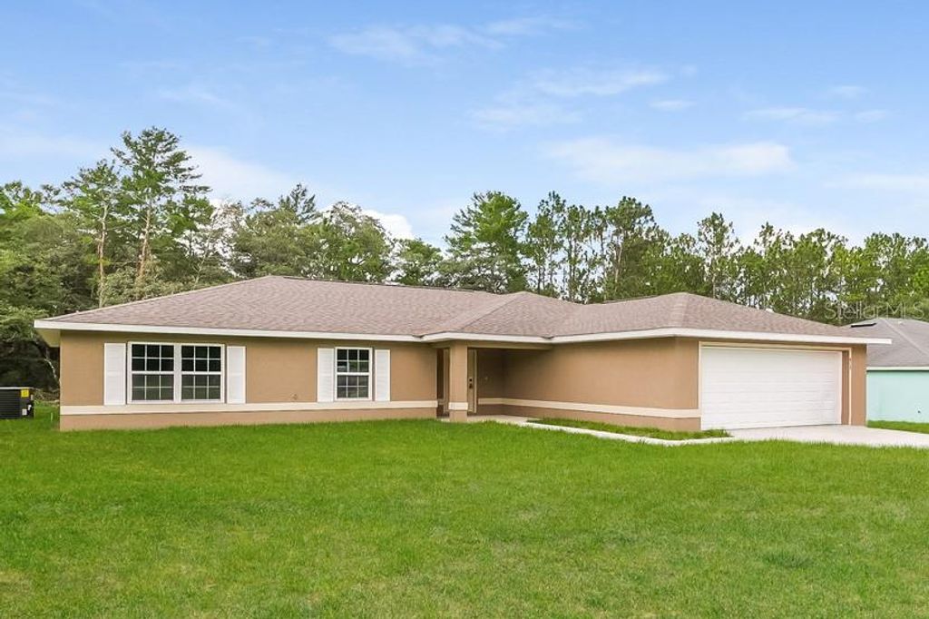 Photo of 419 Marion Oaks Pass, Ocala, FL 34473 (MLS # O6373340)