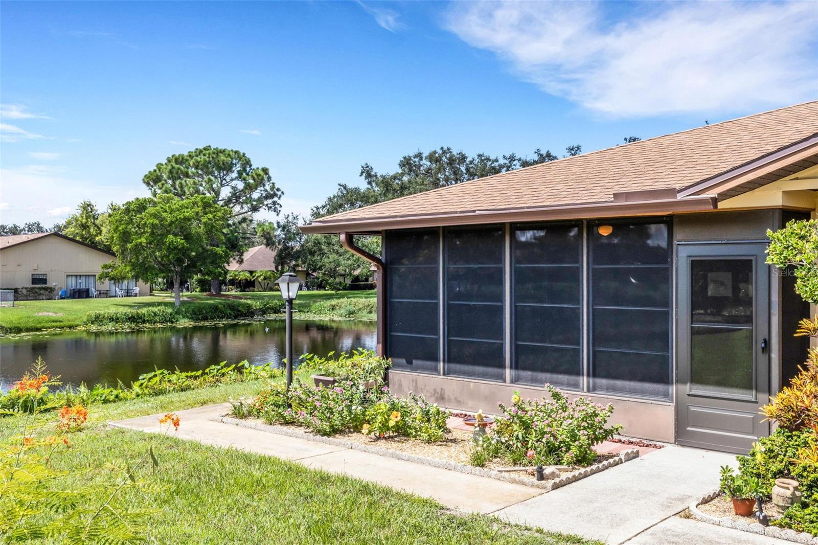Welcome to Heritage Village West - a 55+community! This beautifully maintained 2-bedroom, 2-bath condo offers a rare and peaceful setting with a lanai overlooking a sparkling pond—a feature that very few homes in the community enjoy. Step inside to find an open kitchen, a large laundry room, and a screened porch off the primary bedroom for morning coffee or evening relaxation. Updates provide peace of mind, including a new range (2024), refrigerator (2019), AC thermostat (2025), water heater (2025), washer (2020), dryer (2019), toilets (2019), and a new storm door. Heritage Village West is a clean, well-run community with amenities designed for an active Florida lifestyle. Residents enjoy a heated swimming pool, shuffleboard courts, clubhouse, library, and a calendar full of activities, making it easy to connect with neighbors and friends. This condo offers the perfect blend of comfort, convenience, and community living—don’t miss your chance to make it yours! Located in a fantastic spot just 4.5 miles from the beach and minutes to top shopping, dining, and everyday conveniences, this condo is truly at the heart of Florida living.Turnkey furnished!