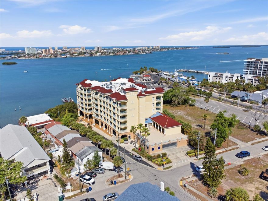 Welcome home to Bayview Condos, an amenity-rich waterfront community overlooking beautiful Clearwater Harbor and ideally located just blocks from downtown Clearwater and Imagine Clearwater. From the moment you arrive and make your way up to the 3rd floor, pride of ownership is evident throughout this beautifully maintained and fully furnished 3 bedroom, 2 bathroom condo offering nearly 1,600 square feet of thoughtfully designed living space. Inside, the spacious split-bedroom floorplan feels light, open, and inviting, with a modern kitchen featuring granite countertops, stainless steel appliances, and generous barstool seating that flows seamlessly into the living and dining areas, making everyday living and entertaining effortless. The owner’s suite is a true retreat with its own private sliding glass door access to the balcony, a large walk-in closet, and an ensuite bathroom complete with dual granite topped sinks, a seamless glass enclosed shower, and a separate jetted soaking tub. The guest bedroom also offers a walk-in closet and is conveniently positioned near the guest bathroom, while the in-unit laundry adds even more convenience. The third bedroom has glass french doors and is currently being used as an office. Step outside to the large private balcony and take in the beautiful views overlooking Clearwater Harbor, the perfect place to enjoy your morning coffee or unwind at the end of the day with stunning sunrises and sunsets. This residence also includes two designated parking spaces in the gated garage beneath the building, along with a private climate-controlled storage unit. Bayview Condos offers a true resort-style lifestyle with amenities that include a heated saltwater pool, fitness center, recreation room, activity deck, outdoor grills, and access to the Intracoastal for kayaking or paddleboarding. With the marina next door, boating enthusiasts will love the convenience of having the option to bring their boat too. Perfectly positioned to enjoy a peaceful waterfront setting without the congestion of beach traffic, this location offers the best of both worlds. You’re just one mile from downtown Clearwater and the new Imagine Clearwater waterfront redevelopment, where you’ll find waterfront parks, walking paths, events, dining, and entertainment. Clearwater Beach, known for its sugar-white sand and vibrant atmosphere, is only 3.5 miles away, making spontaneous beach days effortless. Nearby parks, the Pinellas Trail, local marinas, and year-round waterfront activities offer endless ways to enjoy the outdoors, while Tampa International Airport is just about a 30-minute drive for easy travel. Whether it’s a sunset stroll downtown, a day on the water, or a night out, everything you need is right at your fingertips.