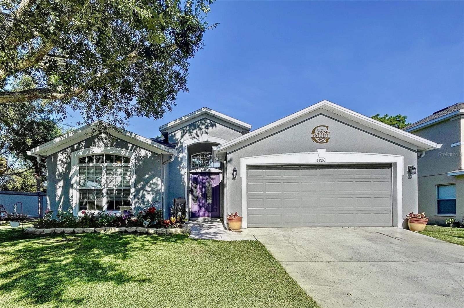 Great gated community with a low fee. Large corner lot with a beautiful yard with sprinkler system and no rear neighbors. Brand new roof!!! This home is a smart home with gorgeous epoxy floors and ceramic tile in the wet areas. Two of the bedrooms and a bath are off to the side if you were in need of an in-law suite situation. Spacious dining room with chair rail for a little added elegance. You know on the holidays where does everyone end up? That's right the kitchen, have no fear there is plenty of room in this one beautiful epoxy countertops, freshly painted cabinet and lots of them,freshly painted cabinets and a large breakfast bar. Washer and dryer closet just off the nook and both are staying. All this looks into the extra large great room big enough for a gaming area. The master bedroom has a loveseat in the window area, and two walk-in closets. The master bath has double sinks, garden tub and walk-in shower. All baths are updated. Outside you will find the lanai leading out to the papered patio. The community offers 2 pools, gym, splash park, dog park, RV/Boat storage tennis court, volley ball, playground, and 2 clubhouses. A great house for a great price. Use our preferred lender and get $2000 towards your closing costs. CDD is included in the tax bill. Call today!