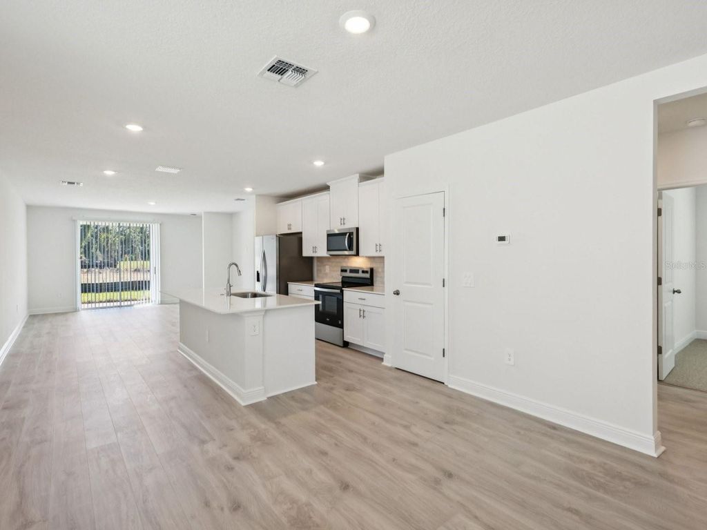 Photo of 887 Sunshower Drive, Lady Lake, FL 32159 (MLS # TB8497866)
