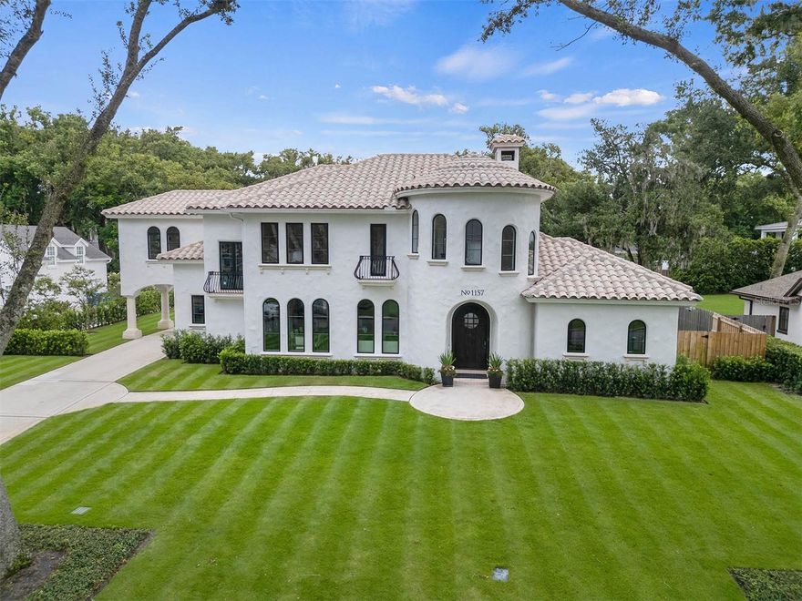 Discover an exquisite Santa Barbara style Mediterranean that's undergone extensive renovations completed in 2024 to blend timeless elegance with modern luxury... This property is nestled in the heart of the prestigious Winter Park "Vias" - one of the area's most coveted locations, and only three houses from the WPRC... This stunning 5-bedroom (w/ the primary & guest suite both on 1st floor), 6-bath residence + office + bonus spaces, offers all the benefits of new construction without the wait or stress, boasting professionally designed interiors that exude sophistication and style… Step into the grand foyer, where a sweeping staircase and soaring ceilings welcome you into the heart of the home. The light-filled gathering room, adorned with a beautiful fireplace and is illuminated by three sets of French doors and expansive 2nd story windows as well, allowing natural light to cascade throughout the space. The gourmet kitchen is a chef's dream, featuring two striking waterfall islands, custom cabinetry, Caesarstone countertops, a 48-inch gas range, a Sub-Zero refrigerator, and a Meile coffee maker and steam oven. A secondary back staircase allows for easy access to the second floor from the kitchen with its four arched picture windows... The adjacent gathering room enjoys a two-story soaring ceiling with wall of glass flooding light in and included a fireplace, adjacent wine cellar and lanai - ideal space for entertainment… The private owner’s suite is a luxurious retreat, complete with a cozy sitting area, a stunning stone fireplace, vaulted ceilings, and large picture windows that frame serene views of the pool and manicured grounds. This suite also includes a custom walk-in closet/dressing room and a spa-like bath with a stand-alone soaking tub, dual vanities, and a beautifully appointed walk-in shower. The main level also features a front-facing office, perfect for working from home, and a private guest-suite with an ensuite bath and walk-in closet...  Ascend the elegant, curved staircase to the second level, where a cozy loft and three additional bedrooms with ensuite baths, marble floors, and custom closets await. Additionally, the upstairs living encompasses a study alcove and a wonderful, oversized bonus/flex space...  The outdoor living is equally impressive, with a covered lanai offering a serene spot for lounging and alfresco dining while overlooking the sparkling saltwater pool and wonderful, expansive back yard that is rare to find in Olde Winter Park homes.  Note: The total AC area in this home per building plans is apprx 5,550SF... the main living area is ~4,500SF and lives/feels larger with spacious, open living areas that include 2-story ceilings, plus the additional ~1,000SF in a secluded, expansive bonus room that is a really cool, flex room for so many uses... The oversized lot (approximately 108-by-165 feet) provides ample space for outdoor activities and also benefits from a tranquil, very private setting… A covered drive through porte-cochere leads to the generous side-entry 3-car attached garage, adding to the convenience and grandeur of this stately property. This magnificent residence is just footsteps from the Winter Park Racquet Club and 5 minutes from Interlachen Country Club as well as the upscale shops and restaurants of Park Avenue… This is truly a unique opportunity to purchase a like-new, current design “like new” home offering an unparalleled lifestyle in one of Winter Park's most desirable addresses!!