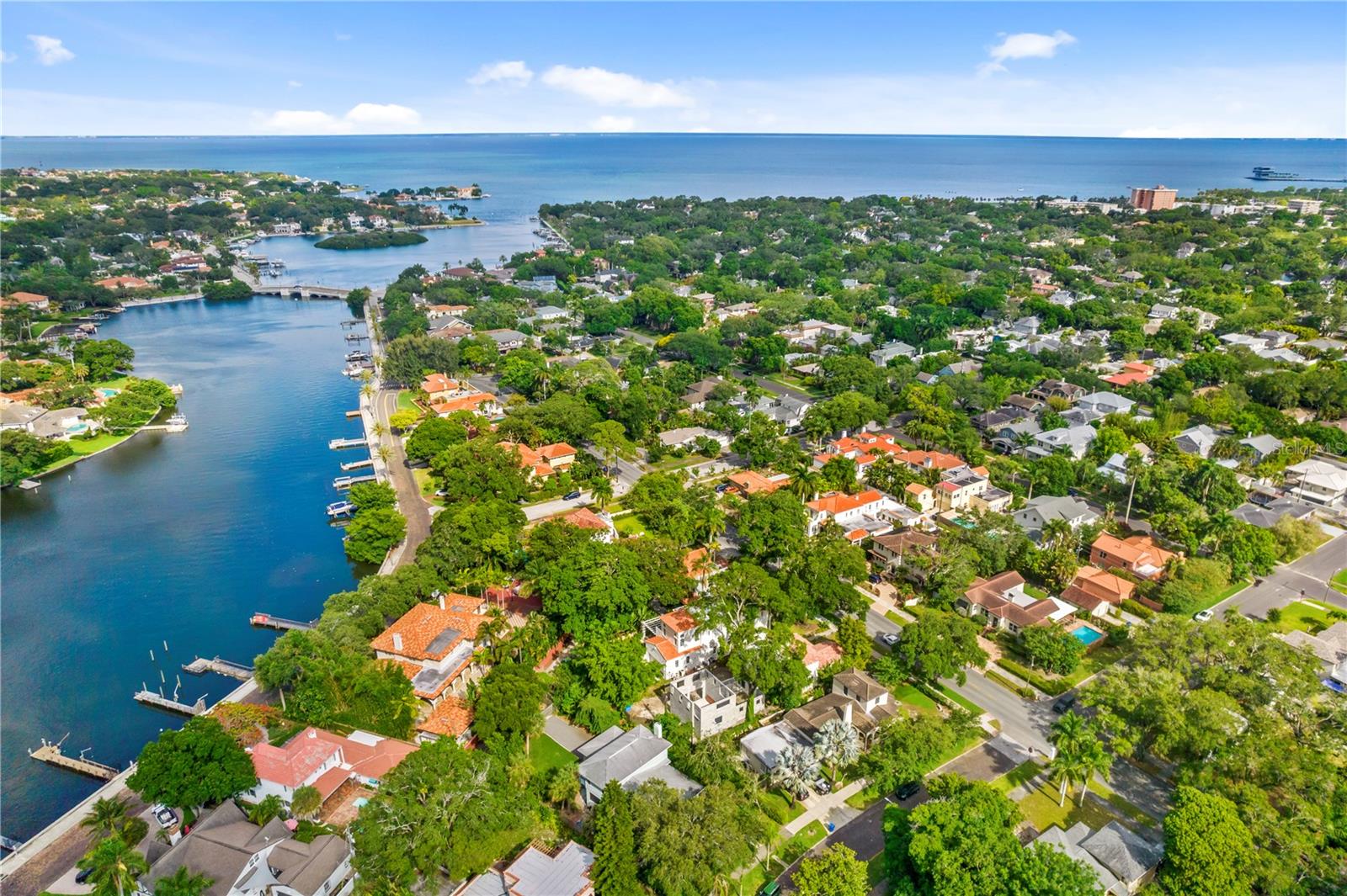 PREMIERE LOCATION in the coveted Granada Terrace section of the highly sought after Old Northeast neighborhood! If the house is torn down, you'll have a rare, oversized lot just over a 1/4 of an acre at 80' wide x 248' deep and just one block in from Coffee Pot Bayou waterfront to build your dream home with plenty of room for a pool and still have room left for a a spacious backyard. The current house, a 1950's Mid-Century home, has been renovated and is in great condition should you decide to reside, add on to the home or rent the home prior to building. Alley access provides for easy coming and going from a garage. Start living the "Florida Lifestyle" with an easy stroll to the waterfront for manatee and dolphin watching or hop on the sidewalk to bike downtown to take in vibrant St. Pete!