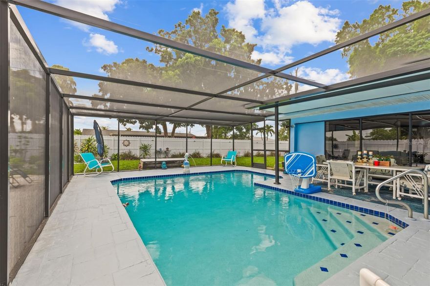 ***SCHEDULE SAME DAY NO COMMITMENT TOUR ON REDFIN***This beautifully updated 3-bedroom, 2-bathroom pool home with no HOA is move-in ready and designed for both comfort and entertaining. The large kitchen features soft-close cabinets, granite counters, a breakfast bar, and room for a dining area, with plenty of storage. A separate dining room, living room with fireplace, and huge family room provide ample living space, enhanced by crown molding that adds modern elegance throughout the home.

The primary bedroom has its own exit to the pool area and an ensuite with shower, while the other bedrooms are served by a full bath. There is also a versatile room that can be used as an office, hobby space, or additional living area. Ample storage is available throughout the home with multiple large closets in the bedrooms and hallway.

The sliding door to the lanai rolls completely out of the way, seamlessly blending indoor and outdoor living. The lanai offers a large covered area, while the pool features a water fountain and is fully enclosed with a new cage. The fenced backyard is like an oasis with mature landscaping and tropical plants, and there is patio space on both sides of the home, perfect for entertaining.

Additional updates include a remodel for the 1-car garage, impact-resistant windows, a temperature-controlled remodeled garage, new roof, new water heater, new electric panel, new light fixtures throughout, fresh interior and exterior paint, a whole-house reverse osmosis system, and a privacy fence built with a third rail for added durability in high winds. Flood insurance is transferable, providing extra peace of mind. Located close to shopping, boating, Horton Park, and amazing schools, this home blends modern style, comfort, and outdoor enjoyment beautifully. Mortgage savings may be available for buyers of this listing.