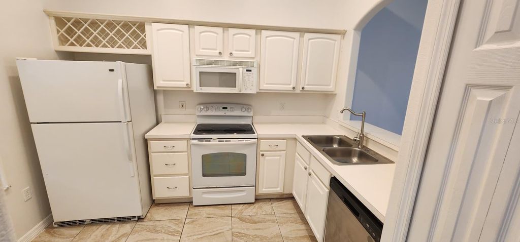 Photo of 2860 Osprey Cove Place #202, Kissimmee, FL 34746 (MLS # O6390235)