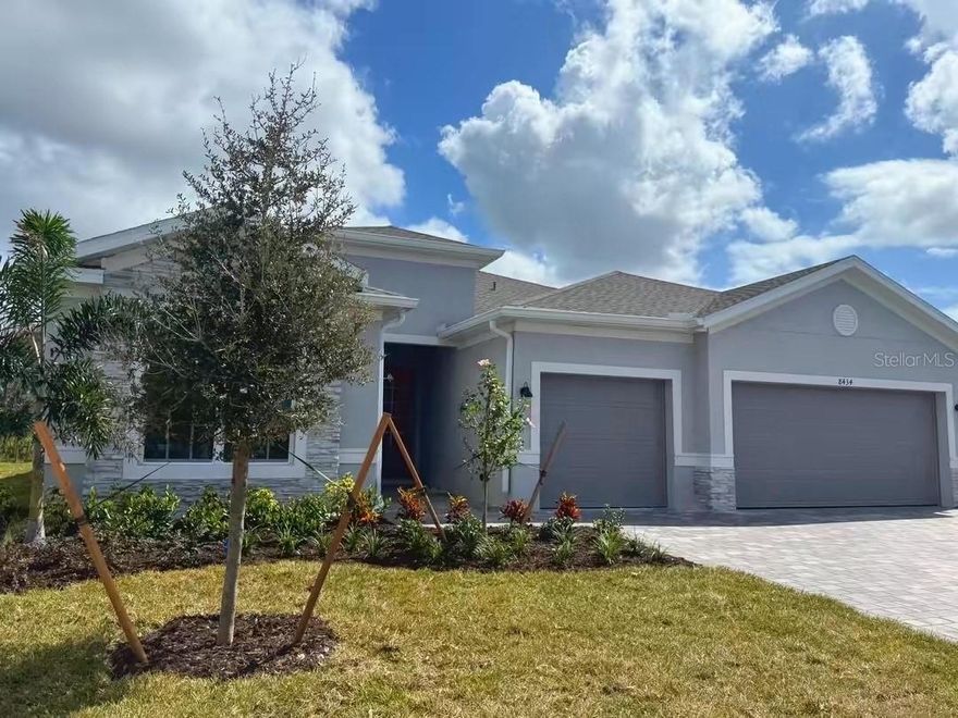 Welcome to your brand-new dream home in the gated community of Island Lakes at Coco Bay.  Completed and move-in ready, this 3-bedroom, 3-bath + BONUS ROOM residence offers over 2,400 sq. ft. of luxurious living space with a heated pool and spa, a 3-car garage, and countless upgrades. YES, you read that correctly, 3 CAR GARAGE so, bring the toys!!!! Features tile flooring throughout, tray ceilings, quartz countertops, a glass double-door entryway, window treatments, and natural lighting throughout.  The open floor plan is ideal for entertaining, showcasing a gourmet kitchen with a 12’ x 4’ quartz island, stylish dining area, and an oversized family room that flows seamlessly to the west-facing lanai. Outdoors, enjoy colorful sunsets, preserve view (with no back neighbors), and a sparkling pool with spa.  The spacious primary suite offers direct pool access and a spa-inspired bath with dual walk-in closets, split vanities, and a 9’ x 4’ shower. Two guest bedrooms provide privacy and convenience, one with an en-suite bath.  Additional highlights include impact-resistant windows/doors, location outside the floodplain (for peace of mind and lower insurance), and energy-efficient design.  Lawn Maintenance & Internet INCLUDED, Golf Carts Allowed, Community amenities include: clubhouse with pool, fitness center, pickleball, tennis, community room and playground.  Prime location: just minutes to Englewood’s pristine Gulf beaches, and a short drive to Boca Grande, where you’ll find charming shops, waterfront dining, and boutique restaurants. Everyday conveniences, grocery stores, and additional dining are also nearby.  Don't let this one get away, call for your private showing.