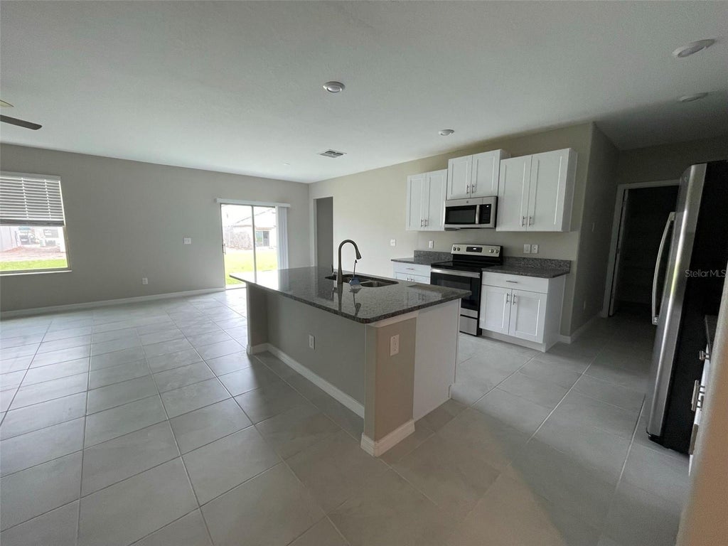 Photo of 31422 Sun Kettle Loop, Wesley Chapel, FL 33545 (MLS # TB8556703)