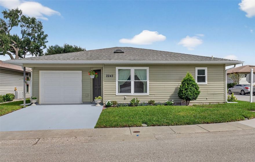 Meticulously maintained and move-in ready! This budget-friendly home is packed with valuable updates, including a new roof (2019), hurricane code garage door (2021), New South brand windows and glass slider (2020) and A/C (2016). There's also a Kinetico Water System (installed 2019) that features both a water softener with dechlorinator and an under-sink reverse osmosis filter for great-tasting water. The interior offers neutral colors to coordinate with any decor, a spacious living room with high ceilings, a dining area off the kitchen and a breakfast bar with space for stools for quick meals on the go! The convenient inside laundry closet has storage and a washer/dryer (included!) hookup. Just off the dining area is a 13x10 screened patio with an additional outside patio area, perfect for a grilling spot.  The patio has a double-door exit, making it the perfect place to store your golf cart!  Situated on a corner lot in a low-traffic area, this home also includes an oversized single-car garage and reflects pride of ownership throughout!