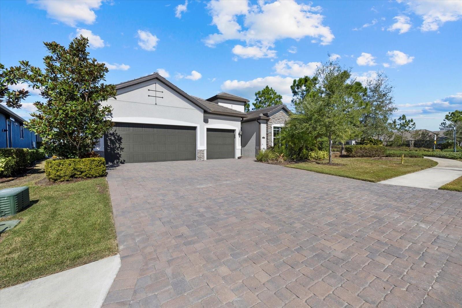Stunning Summerville Model in Arbor Grande – Resort-Style Living in Lakewood Ranch! Welcome to Arbor Grande, one of Lakewood Ranch’s most sought-after gated communities, where maintenance-free living meets world-class amenities! Nestled just off Lakewood Ranch Boulevard, this premier neighborhood offers a resort-style pool, a grand clubhouse with a kitchen, a state-of-the-art fitness center, volleyball, bocce ball, and even pickle-ball! Plus, Arbor Grande seamlessly connects to the scenic Bob Gardner Park, featuring walking trails, a dog park, disc golf, ball fields, a playground, a gravity swing, and two pavilions. To top it off, this community is within walking and biking distance to top-rated Lakewood Ranch schools—a dream location for families! Now, let’s talk about the home! This award-winning Summerville model is nothing short of spectacular. Immaculately maintained and showcasing like a model home, it offers a perfect blend of elegance and functionality. Upon entering, you'll immediately notice the wide hallways, soaring ceilings, and abundant natural light pouring in through the expansive rear sliders that open to your covered lanai and large yard. To your left, a hallway leads to a spacious guest bedroom with an ensuite bath, a well-equipped laundry room, and an oversized three-car garage. On your right, you'll find another guest bedroom and a stylish full bath. Need a flex space? A fabulous office with double French glass doors can also function as an additional bedroom, playroom, or media room! The heart of the home is the great room, where the Summerville model truly shines. This open-concept masterpiece boasts a spacious living room, a formal dining area, and a chef’s kitchen with an oversized island—all framed by breathtaking views of the lanai and lush backyard. For ultimate privacy, the primary suite is tucked away at the rear of the home, offering lanai access, space for a sitting area or desk, dual custom walk-in closets, double vanities, and an oversized walk-in shower with dual shower heads—a true retreat! High-end finishes throughout include plank tile flooring, stone countertops, white shaker cabinets, tall baseboards, crown molding, and 8' doors. Plus, this is a smart home, ensuring convenience at your fingertips! With close proximity to UTC, Lakewood Ranch Main Street, Waterside, Sarasota, and the breathtaking Gulf Coast beaches, this home offers unparalleled convenience and lifestyle. Don't let this dream home slip away! Call today to schedule your private tour!