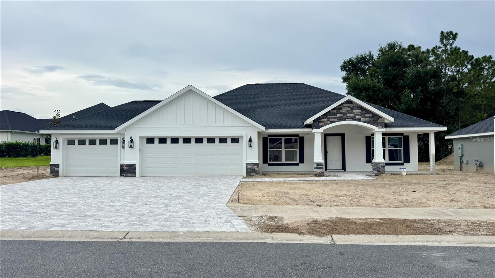 Under Construction. Brand New Construction home available in an award-winning golf course community, Juliette Falls! This is our Rose model: 3 Bedrooms, 2 Full Baths, 3 Car Garage. This plan features an open layout with a large kitchen island and an eat-in kitchen area with french doors to the paver patio. The living room is located right off the kitchen area making this the perfect entertainment home! The master ensuite has a beautiful walk-in shower with floor to ceiling ceramic tile, corner seat, shampoo niche, frameless glass enclosure & a granite vanity with an LED mirror. The spare bedrooms, located on the other side of the house both fit a king size bed and share a full bathroom with a single granite vanity and walk in shower finished the same as the master bath. The garage is a full 3 car finished with epoxy flooring and LED recessed lighting with an oversized paver driveway. This home will be complete with lush landscaping, LED landscape lights & a bluetooth enabled irrigation system. Live in a beautiful gated, top-rated golf course community, located just minutes from Rainbow Springs State Park & the World Equestrian Center! Come see this home today!