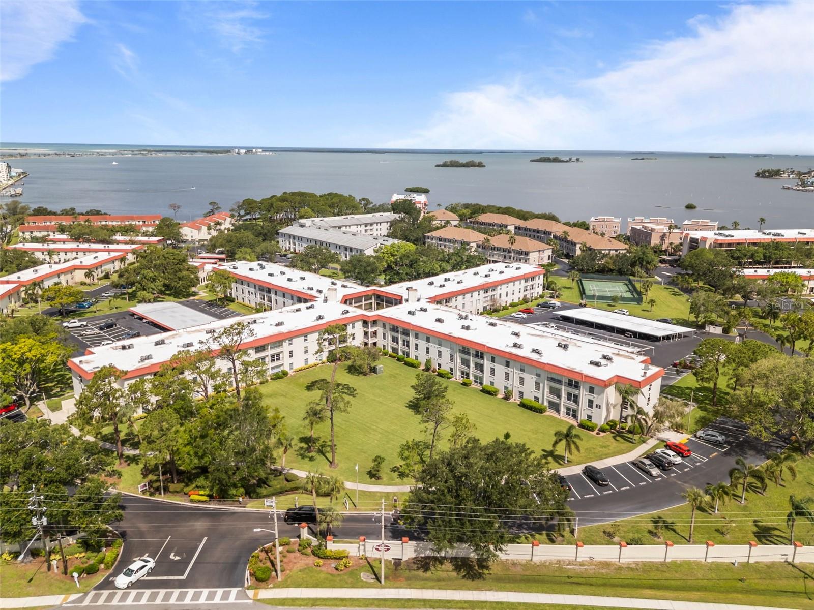 Experience the charm of coastal living in this beautifully updated 1-bedroom, 1-bath condo tucked inside Dunedin’s desirable waterfront community, Mediterranean Manors. This condo offers 670 square feet of easy, low-maintenance living in a quiet end-unit location on the third floor-easily accessible by elevator. Inside, you'll find newer appliances, fresh paint in soft, airy tones, and updated flooring that enhances the light-filled, welcoming feel of the space. Just steps from the laundry room and extra storage locker, convenience is built right in. The unit features a new A/C (2022) and a new roof (2024), along with thoughtful interior upgrades throughout. A dedicated carport keeps your vehicle shaded from the Florida sun and provides additional storage for your beach gear, golf clubs, or weekend essentials. Best of all, the building allows immediate rentals—no waiting period—making it an excellent option for full-time living, a seasonal retreat, or an investment opportunity.
Tucked along the Gulf of Mexico, this coastal community offers the ultimate Florida lifestyle—think morning walks by the water, afternoons by the heated pool, and sunsets from your private waterfront park with boat moorings . Whether you're into beach days, grilling with neighbors, or launching a kayak , this place has you covered. You're also just minutes from vibrant local favorites like downtown Ozona and Dunedin, plus easy access to the Pinellas Trail, Jolley Trolley, golf, marinas, and the world-renowned shores of Honeymoon and Caladesi Islands. Residents enjoy clubhouse with library, fitness facilities, courts for tennis, pickleball, bocce, and shuffleboard, plus included cable, internet, and more. The community welcomes all ages—and even your small furry friend.