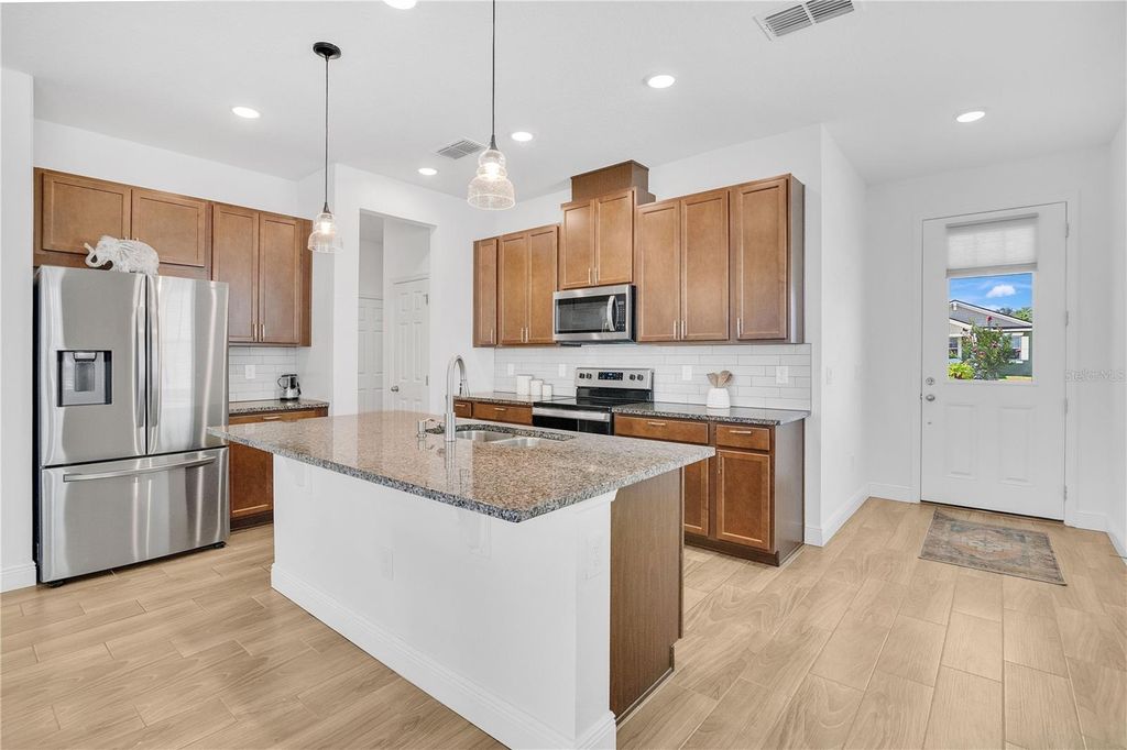 Photo of 3280 Canna Lily Place, Clermont, FL 34711 (MLS # O6363641)