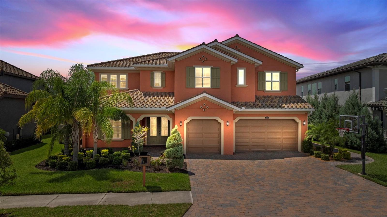 One or more photo(s) has been virtually staged. Stunning 5-Bed, 5-Bath, Pool & Spa Home in Gated, Amenity Rich Community. Discover the perfect blend of elegance, comfort, and resort-style living in this 4,610 sq. ft. masterpiece. The home also includes a private Office and an expansive Bonus Room that are perfect spaces for productivity, creativity & leisure. The meticulously landscaped Mediterranean elevation with a Floridian “twist” barrel tile roof and freshly painted exterior with designer grade paint. The paver driveway & inviting front porch add exceptional Curb Appeal & heighten your senses for what’s inside. Soaring Ceilings, Impressive Foyer, Iron Spindle Staircase & charming Juliet Balcony WELCOME YOU in. The home’s open floor plan flows seamlessly, offering both formal & casual spaces for entertaining and everyday living. The heart of the home is a anchored by a gourmet kitchen that boasts Natural Stone Countertops, an Oversized Island, Farm House Sink, premium appliances, gas cooktop, designer cabinets & walk in pantry. Enjoy your own little SLICE OF PARADISE Outdoors, featuring a Heated Salt-Water Pool and Spa with a captivating custom Rock Grotto. A thoughtfully appointed Outdoor Kitchen with Gas Grill & Smoker, and a secondary Screened in Lanai with a Cozy Gas Fireplace add to the alure of this captivating space. An additional fire feature is set in a tranquil gathering area that provides spectacular sunset views. Two charming, raised garden beds produce a bounty of fresh fruit & vegetables blending beauty & function for a refined Farm-to-Table experience at home. The outdoor living space is nothing short of spectacular, creating the ultimate Florida Backyard Oasis. The home boasts 5 bedrooms and 5 baths with one bed and bath downstairs, perfect for multi-generational families, guests or a home gym. Elegant, Engineered Hardwood Floors flow seamlessly throughout upstairs offering the warmth & character of natural wood. The interiors are freshly adorned with premium paint delivering rich sophisticated color and flawless finishes. The Luxurious Primary Suite serves as a True Retreat with a soaking tub, oversized frameless glass enclosed walk-in shower, dual vanities & premium finishes. Wood flooring is set in the Expansive his & hers closet as well. The floor plan features two beautiful secondary suites featuring private bathrooms, creating personal retreats for family or guests. The fourth bedroom bathed in sunlight includes a walk-in closet. A spacious bonus room, framed by expansive windows that capture abundant natural light, with rich wood flooring, creating an inviting setting for a media lounge, game room, or workspace. A large Three Car Garage with high sealings & epoxy coated floors is where the Whole Home Reverse Osmosis water softening system & Electric Car Charging unit can be found. The garage entry leads to custom built-in launch area offering a stylish, Functional Drop Zone. With its’ Prime Location, nestled in a Gated Neighborhood of highly sought-after Estancia at Wiregrass, the community offers a Clubhouse, Fitness Center, Resort-Style Pool, Sports Courts, Playground, Parks & Walking Trails—it’s a PERFECT HOME for an Active Lifestyle. This property sits in the A-Rated school zone of Wiregrass Ranch. Interstate access, Premier Shopping & Dining, just minutes from downtown Tampa, and Gulf Coast beaches all combine Beauty, Convenience, and Florida lifestyle living at its finest. Make this Exceptional Property YOURS! Schedule your private showing TODAY!