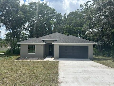 Situated on a quiet street, with mature trees, this new construction 4 bedroom 2 bathroom home has everything you need! You will absolutely fall in love with this layout! Once you pass through the foyer, you are greeted with SO MUCH SPACE! The massive great room boasts an open floor plan, perfect for entertaining family & friends. The oversized kitchen includes GE stainless steel appliances, stunning quartz countertops, white shaker cabinets, pantry and a HUGE center island with breakfast bar. The primary bedroom retreat includes HIS AND HERS walk-in closets, en-suite bathroom with dual sinks and luxury tile walk-in shower. Other upgraded amenities include modern black hardware & finishes throughout, solar powered attic fan, "Low-E" windows and slider, garage door opener with battery backup, painted garage floor and more! In the heart of DeLand with close proximity to the Downtown Mainstreet, the beautiful Stetson University campus, 17-92 & I-4, shops, restaurants and other entertainment venues.
