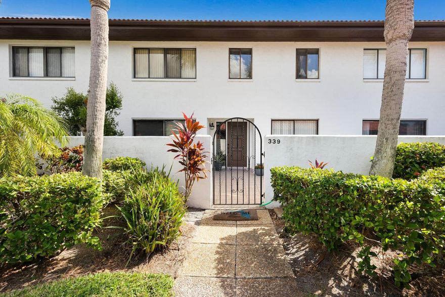 Welcome to a serene community, Valencia, offering a rare sense of privacy, tranquility, and convenience. This well-maintained and professionally managed condominium community is known for its mature trees, lush landscaping, and peaceful setting. 

Ideally located with easy access to shopping, dining, and the airport, the property is also just minutes from beaches, boating, and multiple adjacent communities that allow excellent walking and biking paths. Golf enthusiasts will appreciate being just a five-minute golf cart ride from teeing off at IMG Golf Course, with access to upscale country club and sports amenities without burdensome membership dues.

The condo itself is exceptionally quiet thanks to solid all-concrete construction, offering minimal neighbor noise and a calm living environment. The community is mostly owner-occupied and known for its welcoming atmosphere. The building holds an X500 insurance rating, requires no flood insurance for a mortgage, and has never experienced flooding.

Inside, the residence enjoys beautiful north and south natural light and an abundance of outdoor living space, including three patios, a private sun deck, and a covered upstairs balcony with peaceful, tucked-away views. There’s ample room for bicycles, grilling, and outdoor relaxation, with the community pool just steps away. Parking is effortless with a carport and plentiful guest parking right at the front door. Although conveniently located, the condo is set back from the main road with its own private driveway and parking area.

The renovated interior is comfortable, clean, modern, and stylish, featuring calming, peaceful color palettes, generous storage, and spacious rooms throughout. The layout truly feels like a home rather than a condo offering privacy, functionality, and warmth in a beautifully maintained setting.