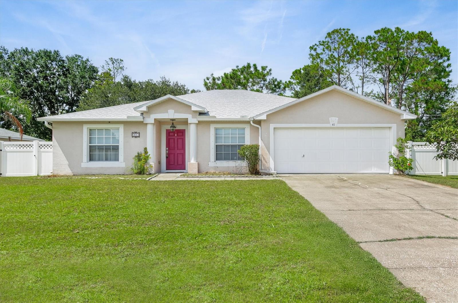 Welcome to 41 Pershing Lane, a thoughtfully designed home in the heart of Palm Coast. Offering 1,636 square feet, this 3-bedroom, 2-bath residence features a desirable split floor plan that blends comfort, functionality, and privacy. At the center of the home, the kitchen stands out with granite countertops, stainless steel appliances, a breakfast bar, and plenty of cabinets—perfect for organization and everyday living. The open living and dining spaces flow seamlessly together, creating an inviting atmosphere for entertaining or relaxing at home.The primary suite offers a private retreat with generous closet space and an en suite bath, while two additional bedrooms provide flexibility for other house members, guests, or a home office. A screened lanai and backyard offer space to unwind outdoors. Conveniently located near schools, parks, shopping, dining, and Flagler beaches, this property combines lifestyle and location. Welcome home!