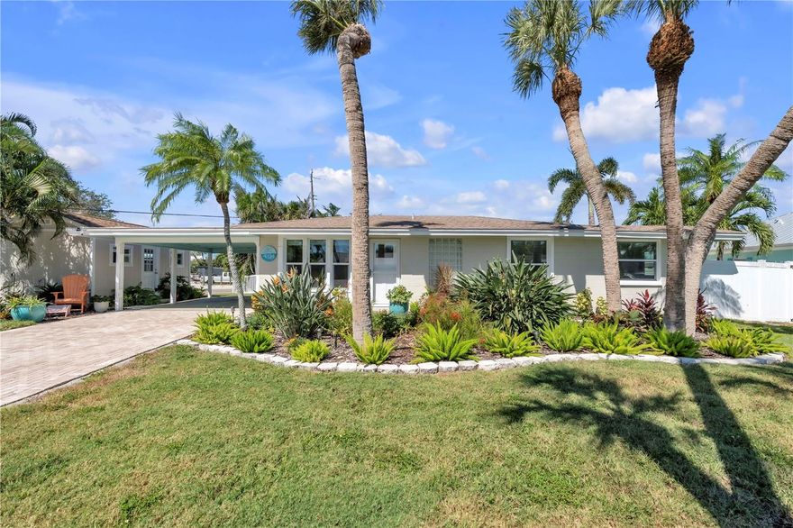 This beautifully updated 2BD/2BA coastal home captures the essence of laid back island living with a bright, open interior and a backyard designed for total relaxation. Inside, warm wood-style flooring runs throughout, setting a comfortable tone that pairs perfectly with the home’s coastal palette. The kitchen is crisp and inviting, featuring sleek quartz countertops, stainless steel appliances, and a sea glass toned backsplash that adds a subtle pop of color. Just off the kitchen, the dining area flows into a spacious living room with sunroom style windows that fill the space with natural light and frame views of the lush, tropical landscaping. A separate family room offers a second gathering space. Both bedrooms are generously sized, offering plenty of natural light and a sense of comfort. Step outside to discover your own private paradise. The heated pool and spa are surrounded by a spacious paver patio and swaying palms, offering the ideal backdrop for entertaining, unwinding, or soaking up the Florida sun. A detached shed with finished interiors adds flexibility to suit your lifestyle. There also is a boat slip with water, electric and a 10,000 lb lift available for separate purchase right up the street. Located just a short stroll or bike ride to the sugar white sands of the Gulf and the vibrant shops, restaurants, and beachy charm of Anna Maria Island, this home offers the perfect blend of comfort, convenience, and coastal character.
