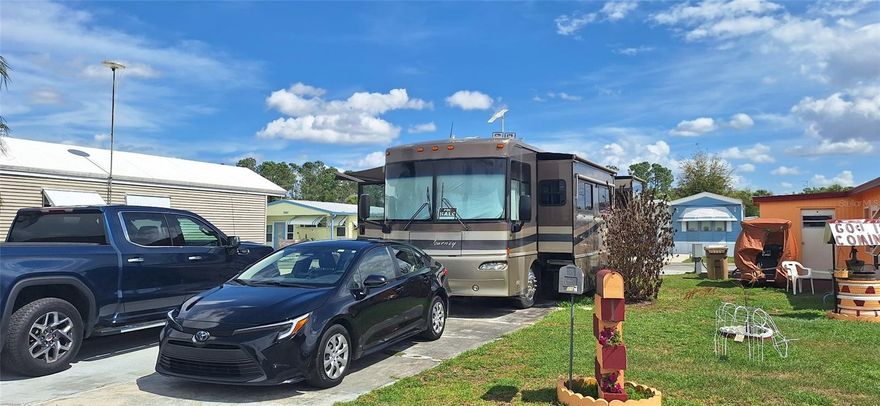 Welcome to your future home in a vibrant 55+ community, ideally located along the peaceful canal that connects Lake Hamilton and Lake Henry, offering beautiful views of Lake Henry. This is a perfect setting for boating and fishing enthusiasts, with exclusive access to the canal.
The community offers a variety of activities and amenities for residents to enjoy, including a refreshing swimming pool, well-maintained shuffleboard courts, self-service laundry facilities, and secure storage for recreational vehicles and boats. You can also enjoy the peace of mind that comes with living in a gated community where security is a priority. Please note that the property includes a 99-year land lease. The lot is being sold with an RV (recreational vehicle) included in the price, making it a great opportunity to start enjoying this lifestyle right away