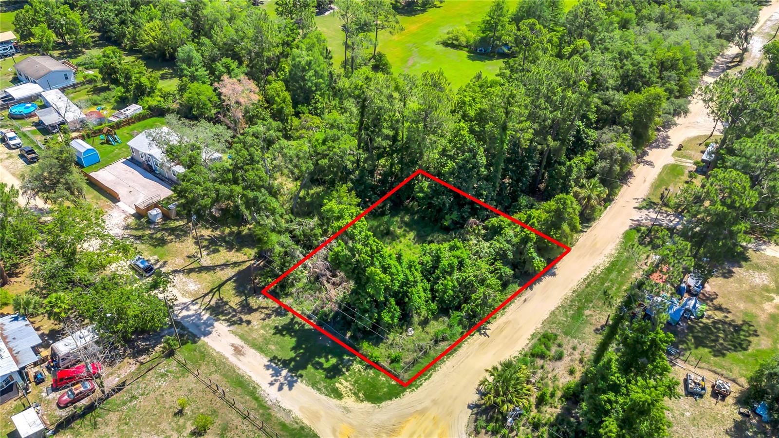 Nice large corner lot to build your dream home. Also zoned for mobile homes or manufactured homes. There was a previous mobile home on the property that was demolished and removed. There was also electricity previously connected to the property , the electric pole and meter panel box is still on the property. There is also a shared Well with adjoining neighbors but i would recommend installing you own well. I was told by the previous owners there is a septic tank located on the property but was not confirmed.