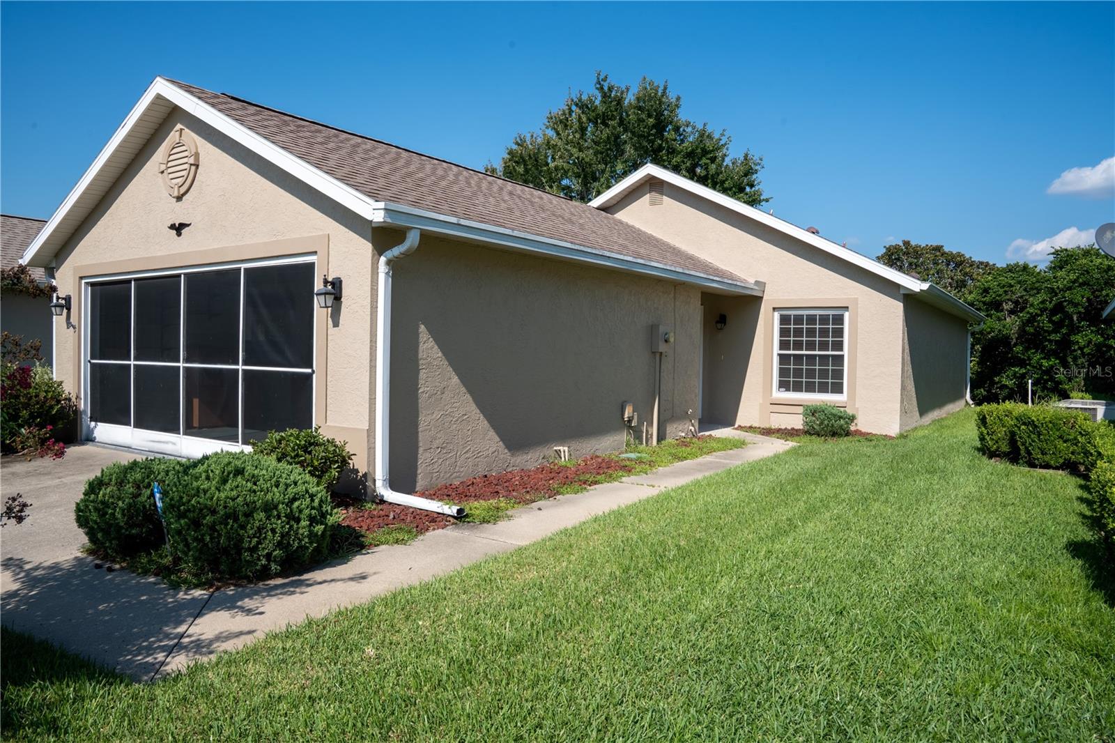 This well cared for, attractive 1,182 sq ft split 2-bedroom, 2-bathroom, 2 car garage home, is located in the premier 55+ active adult golf community of Ocala Palms, a guard gated community that offers an exceptional lifestyle for it's discerning residents. Nestled in NW Ocala, the homeowners in this well established community enjoy fabulous amenities, you will never be bored in Ocala Palms with the aerobics, floor and water, arts, crafts, billiards, bingo, bowling leagues, book clubs, chess clubs, karaoke, line dancing, pickleball and way too much more to mention. More than enough ensuring that you will always have something to do. This stunning home is a must see 2-bedroom, 2-bathroom split plan with inviting dining and living rooms is sure to please. The comfortable and easy to cook in kitchen leads to the dining and cozy living room area. Continue on through the sliding doors you will find a glass enclosed lanai, perfect place for your morning coffee or late afternoon cocktail. The ensuite has a large walk in closet, and direct access to the lanai as well.