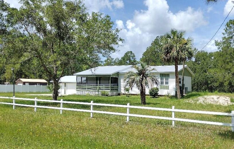 Embrace peaceful country living with this charming 3 bedroom, 2 bath manufactured home situated on a beautiful 165x300' cleared county lot. Offering both comfort and functionality, this well-kept home features a metal roof and a blend of open living spaces and cozy corners for your lifestyle needs.
Step inside to find a large living room perfect for gatherings and relaxation. The functional kitchen includes a center island, ample cabinetry, and counter space ideal for home cooking and entertaining. Just off the main living area, enjoy a light-filled Florida room—a great bonus space for an office, hobby room, or sitting area.
The spacious master bedroom boasts a private master bath with shower. Two additional bedrooms with space for guests or a home office. A well-equipped laundry room with ample storage space, keeps everything organized and out of sight.
Enjoy mornings on the welcoming front porch, and take advantage of the detached 2-car garage for vehicles, tools, or recreational gear.
With plenty of room for a garden, animals, or your favorite outdoor hobbies, this property offers the freedom of country life with room to grow—all while being within easy reach of shopping, dining, and recreation.
Don’t miss your chance to own this slice of rural paradise!