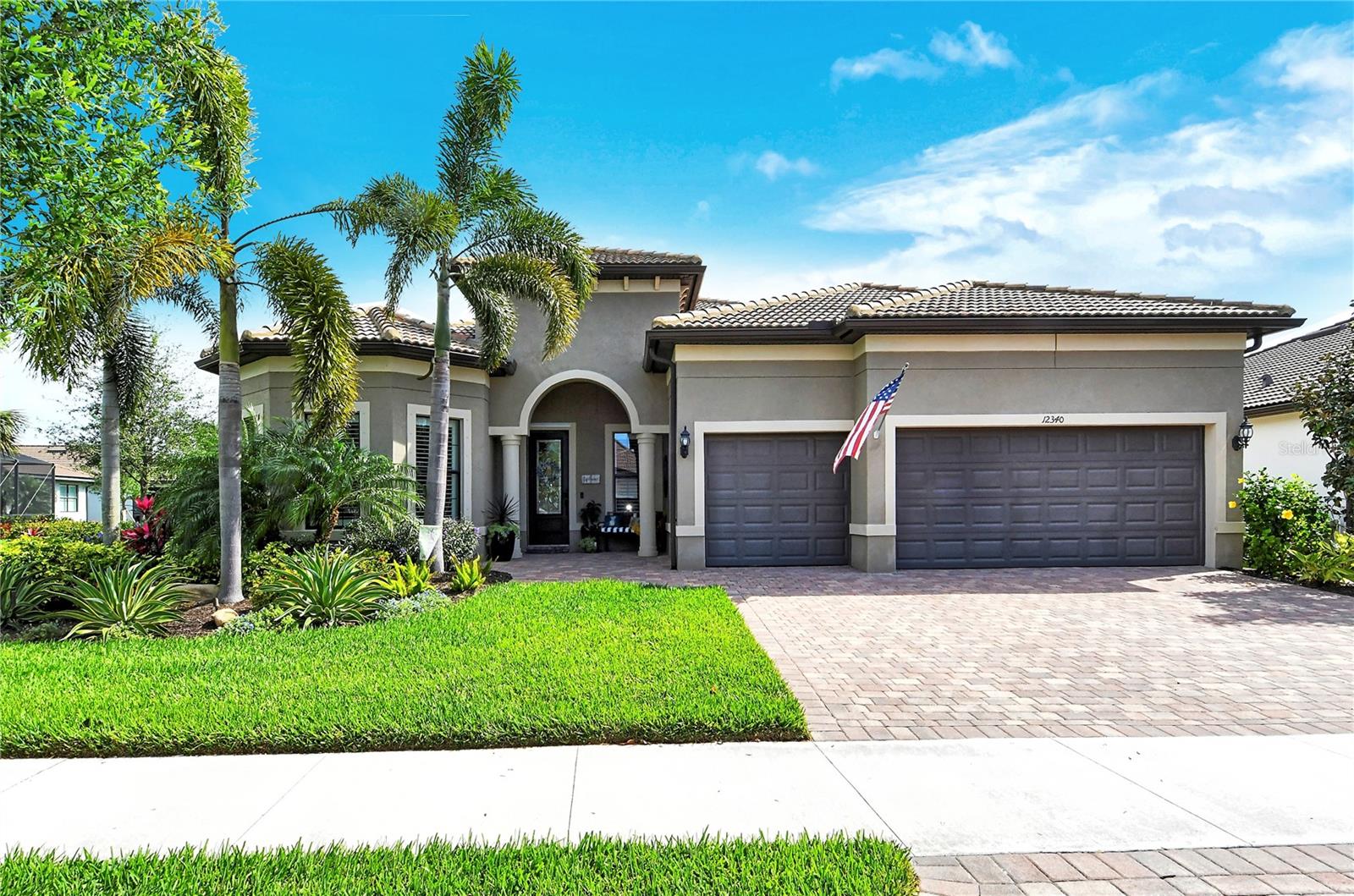 Come take a look and fall in love with this open concept, split-floor plan built by DIVOSTA Homes in the sought-after community of Hammock Preserve on Palmer Ranch. The PINNACLE model offers one floor living with 3 bedrooms, 3 baths, an office/den, and 3-car garage. Greet the morning relaxing on your expansive lanai surrounded by privacy landscaping and graceful Royal Palms. While lounging by the beautiful heated saltwater pool and spa, watch the colorful, vibrant glow of the sunrise reflecting off the lake as the lighted fountain cascades like raindrops on the surface. Love to grill outside? Enjoy the full outdoor kitchen with mini-fridge, sink and storage while being mesmerized by the electric floor to ceiling stone fireplace. Inside the home features 11 foot ceilings with 8’ interior doors. The stylish eat-in kitchen is ideal for preparing home-cooked meals, equipped with stainless steel appliances, quartz counters, a massive center island, and customized walk-in pantry complete with counters and electrical outlets. The spacious great room/kitchen/dining area combo creates a warm and inviting atmosphere ideal for relaxation. Unwind in style in the large master bedroom featuring an en-suite bathroom with large walk-in shower, dual sinks and spacious customized closet featuring built in cabinets, vanity with drawers, pull out hamper and even a jewelry drawer. Upgrades galore in this home…plantation shutters, front entry paver extension, paver sidewalk from driveway to rear lanai, landscape lighting, water purification system, epoxy garage floor, remote hurricane lanai screen, just to name a few! Transferable warranties include…Lenox Air Handler & Heat Pump, 5-yr Builder and 10-yr Structural. Perfectly located within a gated, maintenance-free community, this is a lifestyle community offering tennis, pickle ball, a resort-style pool, bocce ball and a state of the art fitness room. Hang out at the Barefoot Bar or spend time in the clubhouse that offers a large gathering room and kitchen for the many events the community holds. It’s the perfect location near world famous Siesta Key Beach as well as Nokomis Beach, shopping, golf, restaurants, Legacy Bike Trail, & easy access to I-75. Schedule a showing today! Room Feature: Linen Closet In Bath (Primary Bathroom).