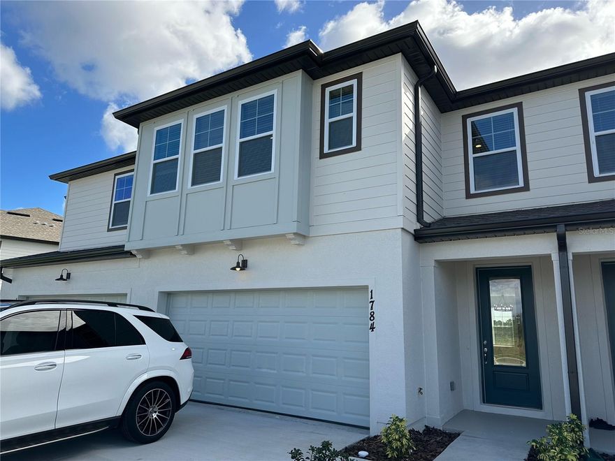 Location! Location! Location! What a beautiful townhouse located at Enclaves at Festival, Champions Gate area Davenport of Central Florida. A vacation living at home. The floor plan called Murano 3 beds 2.5 bath 2-car garage with more than ten thousand dollars design studio upgrades. Fantastic clubhouse amenities with resort-style pool, water park, fitness center, 19-hole mini-golf course, beach volleyball, walking trails, and more. Including the full landscaping services, maintenance, and fertilization. Water view in both front and back of the house. Come to see how you can reflect your tastes and passions in a new townhouse with views of protected wetlands amazing community. At The Enclaves at Festival- a community is less a street and more where you are designed to be. You will love the possibilities.