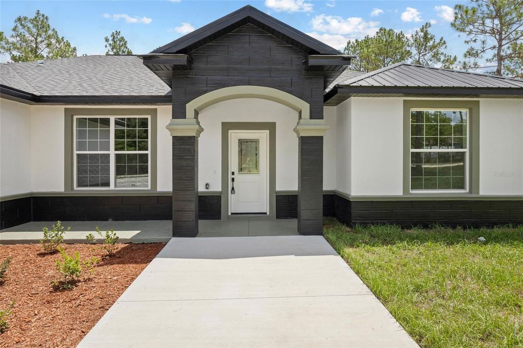 Photo of 9789 SW 125th Court Rd, Dunnellon, FL 34432 (MLS # OM704642)