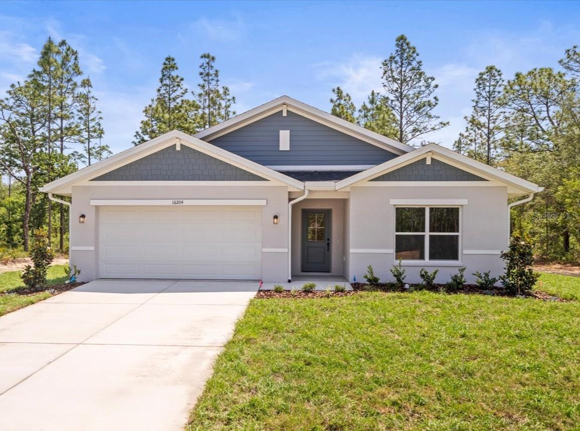 This BEAUTIFUL New Construction Home is MOVE-IN-READY backed by 2-10 Warranty! Built on a great 1/2 acre lot in Royal Highlands peacefully quiet while conveniently located with easy access to an abundance of amenities. Featuring an open floor plan, 4 bedroom, 2 bathroom with luxury laminate plank flooring throughout the entire home. The kitchen features a full stainless steel kitchen appliance package, INCLUDING the refrigerator. Soft close cabinets with granite counters throughout the home with 42'' uppers and a full tile backsplash in the kitchen. Primary en suite bathroom featuring tile flooring, a full tile shower and walk-in closet. Front and back yard is landscaped with irrigation. No HOA and no CDD! This home is a MUST see!